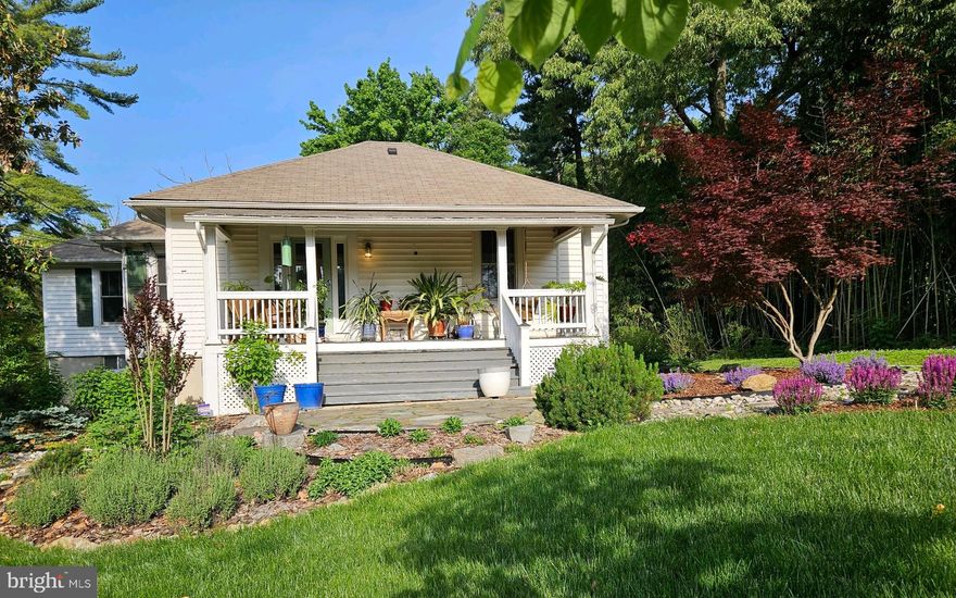 Your oasis from the hustle and bustle awaits! Flanked by beautiful bamboo, this warm and inviting renovated 3 bedroom, 2 bath bungalow is absolutely charming. Nestled on 1.59 acres this home feels more like a retreat destination. Relax on the front porch and enjoy the grandeur of the magnolias trees and beautifully landscaped yard bursting with hibiscus, tulips, hosta, perennials and so much more. It s a gardener s paradise! This inviting bungalow features hardwood throughout the main level, separate living room and dining room, bright and airy kitchen with breakfast bar, granite counter tops, and stainless steel appliances. The lower apt  with 1 bedroom and full bath is perfect for overnight guest, entertaining or as a rental to generate income.  The apt has a large living room, dining room, kitchenette, and washer/dryer. Let your imagination e and green thumb go wild in the massive rear yard. Other features include CAC, beautiful landscape lighting, stone steps, Anderson windows, basement waterproofing (2022), and ample drive way,  Minutes to the Capital Beltway, Metro rail, Marc train and downtown DC. Make this beautiful bungalow your new home!