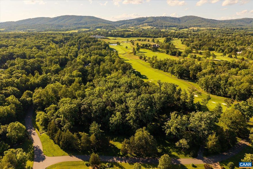 Unique opportunity to own one of the best homesites in the acclaimed Keswick Estate near Charlottesville. Located behind the gates on Club Drive, this 3.25 acre parcel is one of the last remaining buildable lots on the famed Pete Dye-designed 'Full Cry' golf course. Situated on the scenic 2nd fairway, the land is nearly level with a gentle rise in the rear. It features a meandering creek at the front of the lot and long golf course and Blue Ridge Mountain views in the rear. A healthy stand of native hardwood trees offers privacy or could be selectively cleared for terrific curb appeal and a lovely park-like feeling. Pick your architect and your builder to design your dream home with no construction commencement deadline. The amenities of the luxury Keswick Hall resort and members' Club are half a mile up the private road. Enjoy world-class dining at Marigold by Jean-Georges, a brand-new spa, fitness center, multiple pools, clay tennis courts, pickleball and more. This esteemed Keswick Estate community blends prestige, serenity, timeless elegance, and is the location of the notable 2025 Southern Living Idea House. Less than 10 miles to downtown Charlottesville and the University of Virginia.,Lot 13 Club Drive