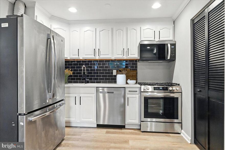 Priced To Sell Fast! Highly Sought After Updated 2 Level End Unit Townhome, Spacious Kitchen with QUARTZ Counters, Stainless Steel Appliances, Modern Tile Backsplash, Spacious Bedrooms, Updated Bathrooms, New Flooring, New Lighting, Driveway, Patio, Much More!!  Close to Schools, Shopping, Metro, and Commuter Routes.  This Will Not Last!