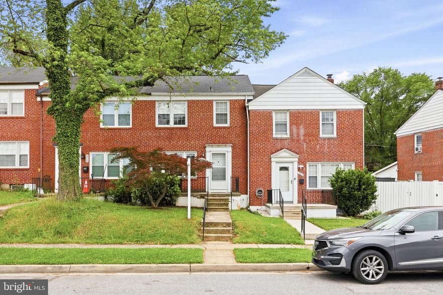 Steps away from The Towsontowne Center, Grocery Shopping, Restaurants,  and all the amenities of Towson.  This solid built All Brick townhouse has a great front porch to enjoy morning coffee or a beverage at the end of a long day.  You are welcomed in by the hardwood floors and abundant natural light streaming from the the replacement windows.  Traditional floor plan of spacious living room open to the dining room then kitchen for the perfect layout.  with 3 Bedrooms and 1.5 Bathrooms, it's just the right size for you.  The lower level is finished with a family room, half bath, laundry and storage.  Easily access the back yard from the kitchen or the lower level.  It's great for the grill and parking.  If you are looking for convenience and walkability, then this home is for you!