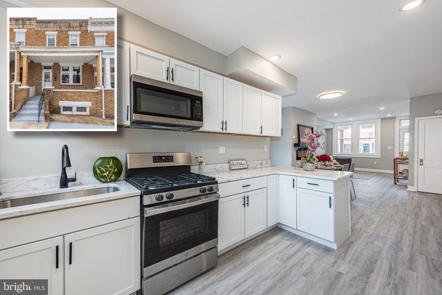 BEAUTIFULLY DESIGNED RENOVATED ROWHOME WITH 3 FINISHED LEVELS & DETACHED GARAGE!  Open floor plan with wood flooring throughout the main level, a spacious living room and dining area with an electric fireplace, a Chef's kitchen with ss appliances & granite counters, upper level with 3 bedrooms & 1 full bath, a finished basement with a family room, 4th bedroom, and 2nd full bath, and a rear patio that leads to the detached garage!