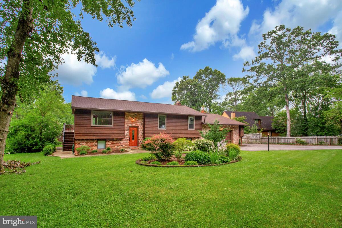 Welcome to 1428 Oak Bluff Road—where expansive water views and thoughtful updates create a rare retreat in Edgewater!
Set on a spacious .33-acre lot with sweeping vistas of Almshouse Creek, this beautifully maintained home offers privacy, comfort, and an inviting connection to the Chesapeake environment.
Step inside to over 2,300 finished square feet of bright, open living space. The main level features a spacious living and dining area with large windows framing the water and direct access to an expansive Trex deck (2022). The updated kitchen includes new GE appliances (2023), refaced cabinetry and under-cabinet lighting (2025), and generous counter space—designed for everyday living and entertaining.
Three bedrooms and two full baths are arranged on the main level, including a primary suite with an en suite bath and custom closet systems. The fully finished walk-out lower level adds versatility with a large family room anchored by a wood-burning fireplace, a fourth bedroom, a third full bath, and flexible space perfect for a home office, gym, or guest suite.
Recent improvements enhance comfort and peace of mind, including a new roof (2022), high-efficiency HVAC system with smart thermostat (2024), new hot water heater (2024), UV water treatment system (2023), chimney relining (2023), all new interior lighting (2024), fresh paint and new carpet throughout (2025), comprehensive electrical upgrades (2025), and a custom basement stair railing (2023).
Enjoy outdoor living year-round with multiple decks, patios, a masonry fire pit (2024), mature landscaping, and a partially fenced yard. The oversized two-car garage with RV hookup and an extended driveway provide abundant parking for vehicles, water toys, or a boat.
This tranquil location offers easy access to local marinas, waterfront parks, and historic London Town & Gardens, while remaining just minutes to shopping and commuter routes. Bring your kayak or paddleboard and launch from nearby community access points to explore the coves of the South River.
Don’t miss this opportunity to experience Chesapeake living—schedule your private tour today!