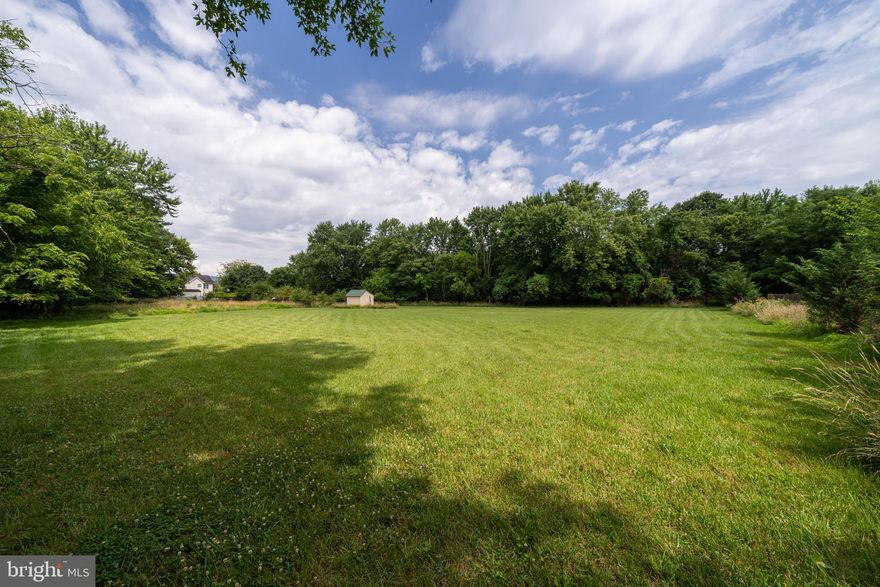 Beautiful homesite with 1.44 acres ready to build your dream home in the city limits of popular Lovettsville. Majestic mountain views, trees on either side, cleared level homesite and a short distance to this charming town, enjoy restaurants, shopping, being on the fun 3th of July parade route block party and more. An easement for the driveway and utilities is to the right of the property in front, with a 10 foot wide area for access. Enjoy the Grapevines,  assorted fruit trees and shed already established on the property. Public water, sewer and electric available from the street, the laterals have not been tapped yet.