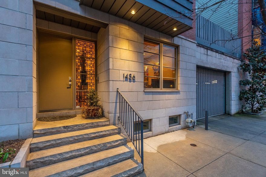 Welcome to 1436 Bainbridge in the Artisan Gated Community in Graduate Hospital!  This well maintained home is located in a perfect location, just off of Broad St. and just steps away from Rittenhouse Square with an amazing 4-CAR PARKING!!!!  This 3,100 square foot home exudes everything a home buyer would want living in the city.  The first floor has a large bedroom/office with a full bathroom, laundry room with storage, sink, and countertop space.  The rear of this floor has a 2 car-garage with additional storage space; additional 2 car parking is behind the garage.  The lower level has a full theatre setup with tiered seating that you will love when having guests over!  The 2nd floor has an open floor plan with a centrally located chef's kitchen with a massive amount of countertop space, Sub-zero refrigerator,  Asko dishwasher, and a Wolf stove.  There is also a large area for dining and on the rear side of this floor a massive living room space with an outdoor deck just steps away.  The third floor is home to another large guest bedroom with ample closet space, a laundry room, and the primary bedroom with a walk-in closet and an en-suite bathroom.  The primary bathroom has a double vanity, seamless glass shower with steam.  Going up one more flight you exit onto your 420 square foot roof deck with amazing unobstructed views of the city skyline.  Dual zone HVAC, surround sound in the primary bedroom, living room, and basement, views of the city skyline on all floors, and an unbeatable location!!  An amazing home inside and out that cannot be missed!!