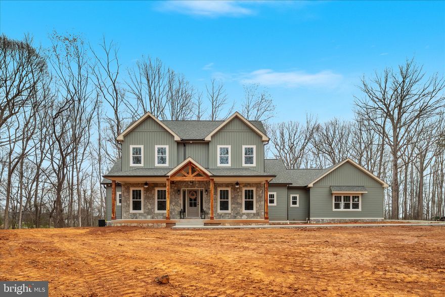 NEW CONSTRUCTION HOME on 5+acres conveniently located close to commuter routes and town of Culpeper! No HOA or covenants.  This popular "Emma" model checks all the boxes and then some! Stunning front porch with natural stone, complimented with locally sourced cedar beams and posts.  Siding is an earthy sage green color in both board and batten and lap/horizontal applications.  Upgraded 2 car garage door with windows, and decorative hardware.  Additional outdoor living on the covered back patio.  The main level offers a beautiful great room with gas fireplace surrounded by gorgeous floating cedar mantle highlighted with custom wainscoting trim and ledger stone  with a bluestone raised hearth.  Cathedral ceiling with fan and recessed lights provide all the ambiance you could want! The well-appointed kitchen and dining nook offer the popular open concept living.  French door refrigerator, stainless steel range hood with custom tile backsplash, abundant shaker style cabinetry and an island with bar seating, under cabinet lighting, recessed lighting and pendant lighting with dimmer switches provide a variety of lighting options! The dining nook also has access to the covered patio for easy indoor/outdoor dining and entertainment.  Adjacent to the kitchen is a butlers pantry complete with additional cabinetry, a beverage cooler/refrigerator, open shelving, and a beautiful leathered granite countertop.  If you work from home, you'll love the spacious office with glass French doors, and natural light streaming in through the windows.  Recessed lighting and a chandelier complete the lighting for this space. There is a 4th bedroom perfect for overnight guests adjacent to a full bath offering stunning custom tile work, and lovely vanity.  Looking for a home with the primary suite on the main level?  We've got that feature too! This primary suite feels open and airy with the cathedral ceiling and access to the back patio for morning coffee or a nightcap! Gorgeous ensuite with custom tiled walk-in shower, dual vanities, toilet room, and a linen closet.  A spacious walk-in closet completes the owner's suite. Last but not least is the laundry room with a utility sink, window, and shelving; and a "drop zone" with bench and hooks for on-the-go storage needs!   The upper level offers two generously sized bedrooms with walk-in closets, and a full bathroom with double vanities, quartz countertop, and a linen closet.  Upgraded carpet and pad offer a soft feel underfoot! If all of this isn't enough, there is a full unfinished basement roughed-in for a future full bathroom and is walk-out level!   What's not to love? Reach out today to schedule your private tour! **Some photos include digital/virtual enhancements.**