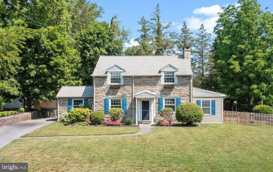 This is the one you’ve been looking for in the highly desirable town of Wayne and the Tredyffrin-Easttown School District - with the added bonus of LOW taxes! Experience easy living from a walkable location to the train, shopping, restaurants, park, the library, and more. 493 School Lane is a traditional Main Line stone colonial situated on a lovely, fully fenced corner property. The front entry welcomes you and guests into the living room to the right and dining room to the left. Abundant natural light, a wall of built-in cabinetry, recessed lights, and a cozy brick-surround fireplace are highlights of the living room. Through the glass paneled door is more living space to cater to any homeowner’s needs, allowing space for a playroom, office, or exercise area. The bright and cheery dining room is open to the kitchen so it naturally creates a good entertaining flow. The kitchen features vaulted ceilings, recessed lights, a large and functional island, plenty of counterspace, and a custom built-in breakfast nook with storage benches. Completing the first floor is a powder room and access to the functional basement used for storage and laundry. Upstairs are 3 spacious bedrooms and 2 full baths. The sunlit primary bedroom suite includes 2 roomy wardrobes, a 3rd generous closet, and an en-suite bath with glass-enclosed shower. The secondary bedrooms offer two corner windows and good closet space, and share a hall full bath. You’ll appreciate beautiful hardwood floors throughout the home, replacement windows, and central air on the second floor. The expansive backyard oasis will have you never wanting to leave home. The large level yard is perfect for throwing a ball around and playing lots of outdoor games, while the paver patio is a great spot to string some lights and set up some chairs around a firepit. The setting calls for endless summer nights with family and friends under the stars, as well as quiet evenings all to yourself. Recent improvements to the home include a new fence that wraps around the property including across the driveway, a newer driveway, replacement windows, a newer dishwasher, washer, and dryer, and recently updated landscaping. The location of the home is fantastic. Drive through the neighborhood you will see plenty of people riding bikes, pushing strollers, and furry friends taking their owners out for a walk. It’s just minutes to major highways, the train (35 min to Philadelphia), the huge shopping complexes of the King of Prussia Town Center and Mall, the charming downtown Wayne area with boutique shops, coffee houses, bars, and restaurants, a historic movie theater, and so many other things that make it the quintessential all-American hometown. Up the road is the historic Devon Horse Show, Valley Forge Park, the Chester Valley Trail for hiking and biking, the popular Martins Dam Swim Club and so much more.  The Wayne Business Association sponsors events throughout the year such as the Music Festival, Fall Festival, Santa’s parade and tree lighting, 4th of July Parade and many other community events. Completing this home are the consistently top-ranked and award-winning public schools as well as easy access to dozens of prestigious private schools and universities. Don’t miss your opportunity to make this lovingly cared for residence your own!