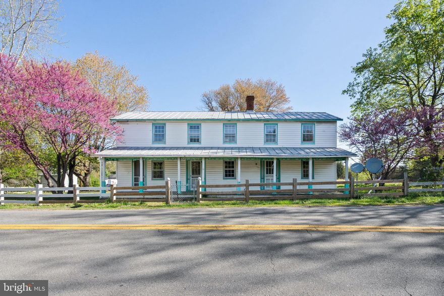 Calling all dreamers, designers & old home lovers!
Step back in time with this charming 1900 farmhouse, originally built by Warren Foster and once home to the Richardsville Post Office! With over 2,000 sq.ft. of living space, this gem is bursting with original character—beamed ceilings, wood floors, brick accent walls, and even a two-sided wood stove flue.

This beauty needs a little TLC, but it’s completely livable and just waiting for someone to add the finishing touches. Imagine sipping sweet tea on the covered wraparound porch, rocking away the afternoon. Inside, you'll find large rooms, classic fixtures, and a double staircase leading to 3 upstairs bedrooms plus a bonus room. Downstairs offers a kitchen, full bath, office, laundry room, family room, and dining room.

Let your HGTV imagination run wild—this is the perfect canvas for your renovation dreams!
Recent updates include a new well pump (2018) and updated plumbing (2016). Outbuildings, sheds, and carports are all ready for your creative touch.

This is more than a home—it’s a piece of local history with so much potential.
