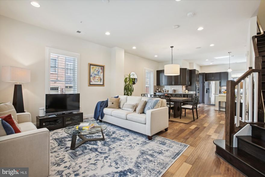 BACK ON THE MARKET! Buyers were past home inspection and excited about purchasing the home. They unexpectedly voided the contract using the condominium document review contingency. We honestly don't know why. It's a beautiful home in great condition and looking for its next owners!

Gorgeous 4 bedroom, 3.5 bathroom townhome with 1 bedroom, 1 bathroom carriage house in sought-after Potomac Yard! The incredibly spacious main level features a living room, dining room, & kitchen with soaring ceilings adorned with recessed lighting, plantation shutters, & engineered hardwood flooring. The chef's kitchen is accented with rich dark cabinetry, granite countertops, sparkling subway tile backsplash, a breakfast bar with pendant lighting, & stainless steel appliances, including a double oven & cooktop with a modern vent hood. A pantry in the back hallway, along with a powder room with a pedestal sink completes this level.

The second level of the home houses the primary bedroom with a sitting area & ceiling fan, a huge walk-in closet with custom organizers, & en-suite bathroom with a large walk-in shower with a bench, granite-topped double vanity, & separate toilet area with linen closet. Two other bedrooms with ceiling fans and a full hallway bathroom with vanity & tiled shower complete this level.

The third level boasts a spacious loft with a ceiling fan which is the perfect spot for a home office. This floor also includes a fourth bedroom with a ceiling fan, a full bathroom with vanity & tiled shower, a laundry/utility room with full-sized washer & dryer, & a spacious multi-purpose room that can be used as a family room, playroom, workout space, or music studio!

The back of the home features a charming private patio that connects the main home to the 2-car garage with attached carriage house. The carriage house features a large bedroom with lots of natural light, a wet bar & wine fridge, a closet, & full bathroom with vanity and tiled shower. This energy-efficient property is a Pearl Silver Certified Home that includes new solar panels (2022) are paid in full, & a Tesla wall connector!  The solar panels save the current homeowner about $150/month on utility bills.

Prime location in Potomac Yard near the brand new metro station, and close to Del Ray, Old Town, and the Pentagon! Nearby dog parks, playgrounds, trails, local shops, & restaurants make this the ideal location!