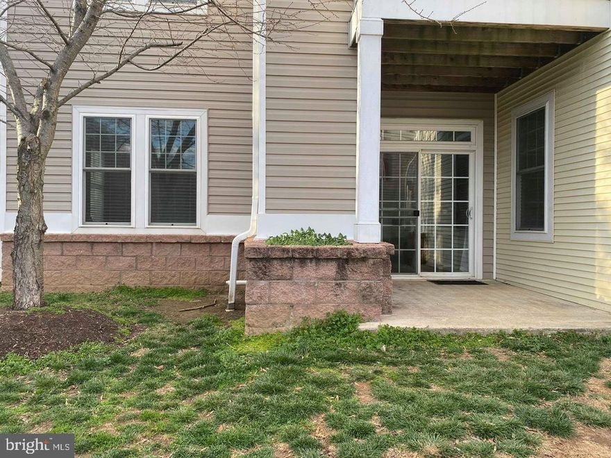 Super handy and convenient 2 BR, 2 BA open concept condo on MAIN LEVEL!  Hardwood flooring in living and dining rooms, kitchen has tile floors, granite counters and 42" cabinetry.  Laundry room has NEWER front loading stacked Washer/Dryer, nice master bedroom with HUGE walk-in closet, master bath with dual sink vanity, and soaking tub/shower.  From the living room sliding glass door, enjoy access to the parking lot making it perfect for bringing furnishings and groceries in and out with ease!This unit has a spacious amount of kitchen cabinets, plenty of closet storage space and two tone paint.  All rooms have faux wood blinds and/or window treatments that convey.  This condo association is not approved for an FHA loan so please consider conventional or cash.