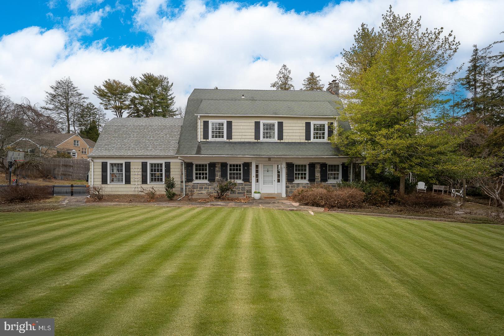 OPEN HOUSE ON SUNDAY 3/9 HAS BEEN CANCELED - PROPERTY IS UNDER CONTRACT. Location, location, location. Nestled on a picturesque tree-lined street in the heart of Saint Davids, this charming stone and shingled Dutch Colonial is located in one of the Main Line's most coveted neighborhoods. From the moment you arrive, you will be captivated by the home's classic stone facade, inviting side porch and mature landscaping. The center hall is flanked on one side by the formal living room with stone fireplace, crown molding and dual french doors to the covered porch. The other side of the center hall is a formal dining room featuring crown molding, wainscoting, deep windowsills and chandelier. The eat-in kitchen boasts newer shaker cabinets, gas cooking, vaulted ceiling and adjoins a spacious family room. The family room features built-ins, bay window and hardwood floors. Both the formal and informal living spaces provide the perfect spot to relax or entertain. The second floor features a generously sized primary suite with a trio of closets. The primary bath boasts a vanity and tub/shower. Two additional bedrooms, one with a bonus room, are served by a hall bath. The third floor offers two additional bedrooms and a hall bath. Exposed beams on this level add an element of charm. Located just minutes from boutique shopping, the vibrant dining scene of the Main Line, and major routes, this home is a true gem for those who appreciate charm and an unbeatable location. The Saint Davids train station is a short walk away. Don't miss your chance to own this enchanting Saint Davids/Wayne home. Schedule your tour today!