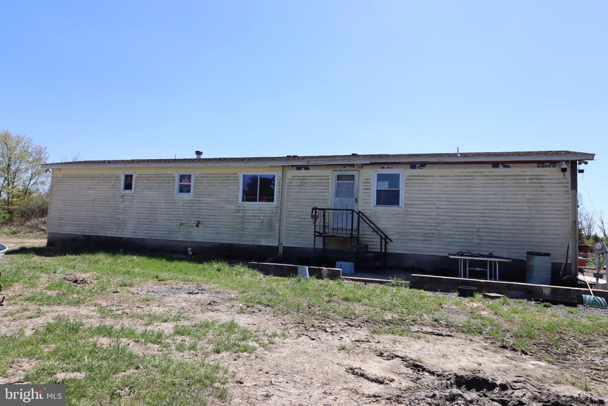 10.33 acres in Richland Township. Property consists of a mobile home in need of repair on a foundation with private well & septic. Also includes 60 x 40 pole barn with stone base and electric. Documents include appraisal just based on land value. All debris will be removed from the lot, the house and the pole barn.