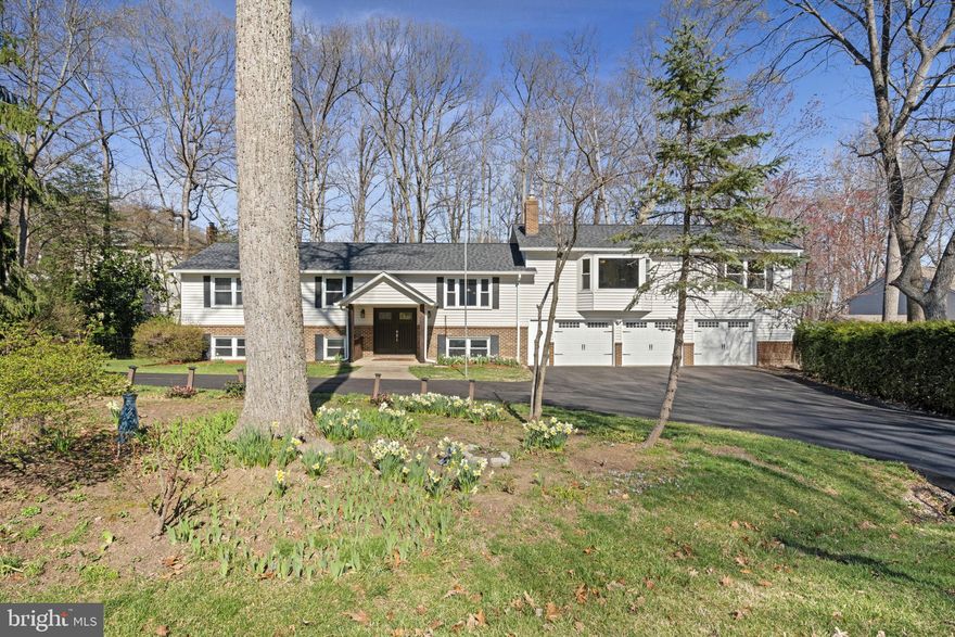 OFFERS DUE TO LISTING AGENT BY 3PM MONDAY 3/31
This spacious and beautifully updated home offers an incredible blend of comfort, style, and functionality, all nestled in a private cul-de-sac surrounded by mature trees. With a massive three-car garage addition, this home boasts generous living spaces, modern upgrades, and a welcoming atmosphere.

Inside, the renovated kitchen (2021) is truly the heart of the home with updated appliances, stylish finishes, and luxury vinyl tile flowing throughout the common areas. Enjoy casual dining at the large center island with stool seating and a built-in beverage cooler. The adjacent breakfast room and sunroom provide a bright and airy space leading out to a tiered private deck, perfect for entertaining or relaxing in the serene backyard.

The main level features new carpeting in the bedrooms (2021) and an expansive primary suite with a sitting room and private bath. A separate formal dining room ensures plenty of space for hosting family and friends. Downstairs, the fully finished lower level impresses with a recreation room, built-in bar, additional bedroom, full bath, office space, and ample storage—ideal for guests, a home office, or multi-use living.

Major updates include a new roof (2019), insulated triple-layer garage doors (2019), and new HVAC units (2022), ensuring efficiency and peace of mind. With first-class renovations, abundant space, and a fantastic location, this home is an unbeatable value! Don't miss your chance to make it yours!