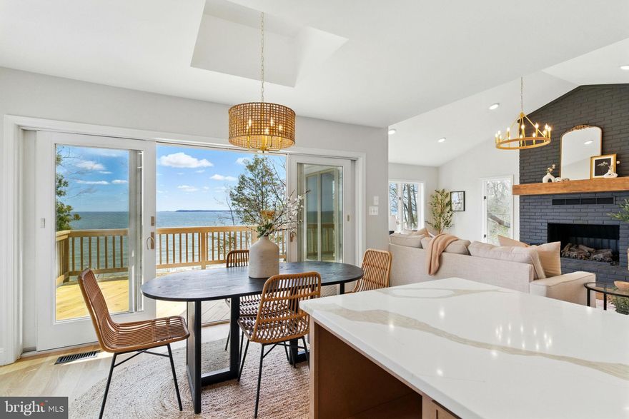 **Exquisite Bayfront Retreat with Private Beach & Panoramic Views of the Chesapeake Bay**

This fully renovated **four-bedroom, three-bathroom** home offers a seamless blend of luxury, comfort, and unparalleled Chesapeake Bay views—an exceptional opportunity for those seeking a **serene second home, a refined retirement retreat, or a year-round waterfront sanctuary** just a short drive from Washington, D.C., and Northern Virginia. 

Step inside to a **completely reimagined interior**, where expansive **Andersen casement windows** frame sweeping Bay views from both levels.

The custom **gourmet kitchen** features **quartz countertops and a premium KitchenAid appliance suite**, perfect for preparing meals while gazing out at the endless horizon - with direct access to the home’s bayfront walk-out deck**.

The main level boasts **3/4 inch white oak flooring**, a **gas fireplace**, and a **primary suite with dual closets, including a spacious walk-in**. Both main-level bathrooms have been elevated with **marble shower floors and accent tiles**, adding a touch of timeless elegance. 

Downstairs, a **fully finished walk-out basement** provides ample space for guests, with three generously sized bedrooms—one with a **walk-in closet** all centred around a large great room/family room.

Outside, a community trail leads you to your **private beach** where you can embrace the Bay lifestyle, whether it’s kayaking at sunrise or unwinding with a glass of wine as the sun sets over the water. 

Located in the **Chesapeake Ranch Estates**, this home offers access to **private lakes, a sandy beach, a community marina, trails, and an airpark**—a rare find for those who value both exclusivity and convenience.

With a **new roof, siding, driveway, and an oversized two-car garage**, every detail has been carefully curated for both style and peace of mind. Also if you need an EV Charger this home is already equipped with one.