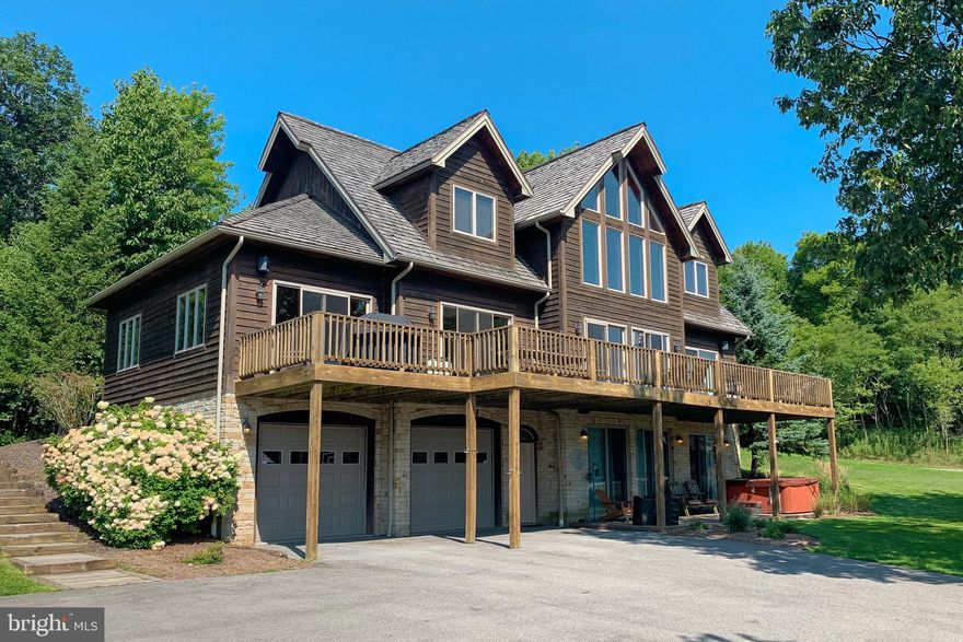 Elegant Mountain Chalet on Highline Dr! This 5 Bed 4.5 Bath lodge boasts panoramic mountain views, monster outdoor decking and is 1 minute to the slopes at WISP. Open concept floorplan features a modern kitchen with stainless appliances, cathedral ceilings with massive stacked stone fireplace, and plenty of glass to let in the views and sunshine. Three ensuites and a Jack & Jill in the basement provides ample space to house multiple families. Lofted game room and 2nd living area in the walk-out basement are perfect for entertaining on those rainy days. “Big Sky” is an established rental and will make an excellent vacation rental while you’re not personally enjoying your Mountain-Lake getaway. Don’t miss your chance to see this Deep Creek classic.. Call today for details!