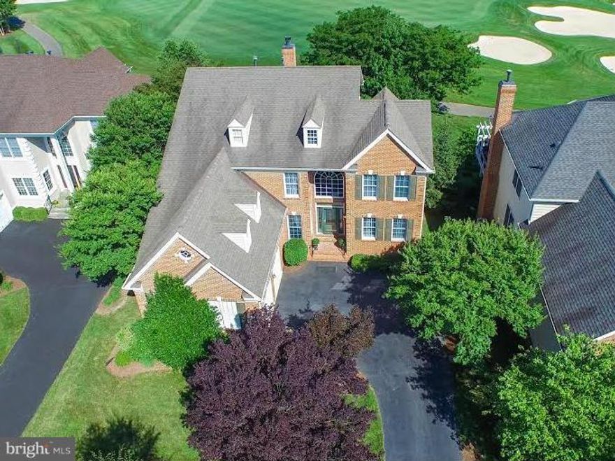 Everything you need & more! Resort amenities inside the gates of Belmont Country Club, Whole Foods & other shopping conveniences practically at the front gate, top rated schools according to great schools ratings & a home that backs to the 18th fairway that is simply spectacular! 4 bdrm, 4 full baths, main lvl mstr, 2 story fam rm, fully fin LL w/bath, office & walk-up. Near planned future metro!