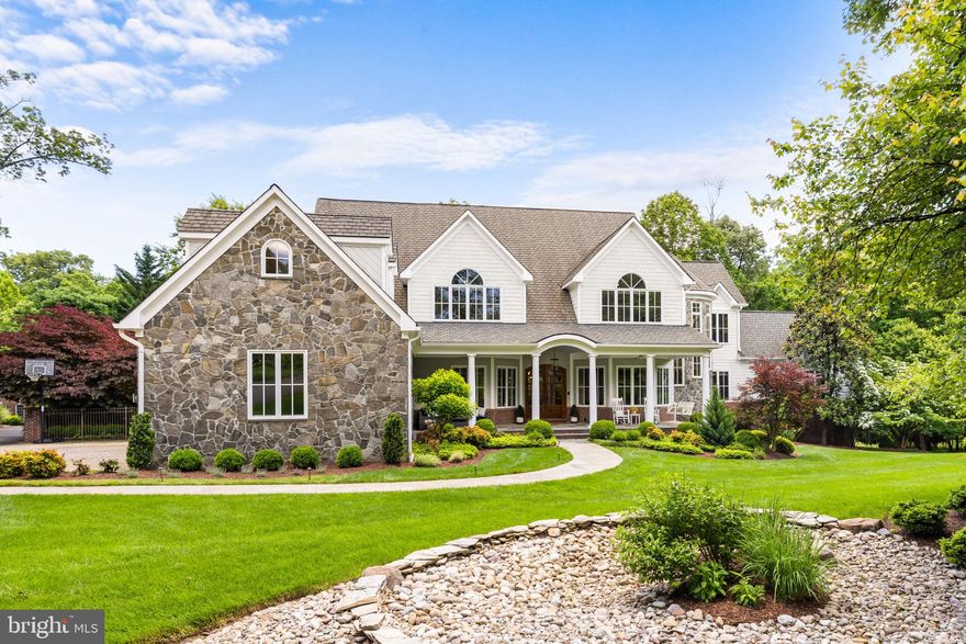 Stunning! Imagine coming home to this breathtaking retreat nestled on 2.54 acres. Beautiful and spacious both inside and out, this unique custom estate consists of an updated interior and exterior and resort-like backyard with renovated pool and spa. The many features of this light-filled home in a private bucolic setting are perfect for both large scale entertaining and comfortable family living. 

Upon arrival, you are greeted by a charming covered porch, leading to an impressive two-story foyer that sets the tone for the exquisite architectural details found throughout the home. The main level features a seamless flow, accentuated by hardwood floors, arches, tailored millwork, a captivating circular staircase and 10-foot ceilings, creating a welcoming and open ambiance.

The entertainer's kitchen is a culinary masterpiece, equipped with professional-grade appliances, an oversized island, and a separate pantry, perfect for hosting gatherings of any size. The adjacent family room, with its vaulted beamed ceilings and a full stone wall with a gas fireplace, opens to the 'country club' covered balcony, offering a seamless indoor/outdoor experience.

Unwind in the main level owner's suite that features doors to the balcony, a sitting area, fireplace, double walk-in closets and a luxurious spa-like bath with double vanities, a soaking tub, and a large enclosed glass shower. Additionally, the main level boasts a modern living room, dining room, office that features a built-in aquarium, a mudroom and laundry room.

The upper level hosts a central second family room with built-ins, providing ample space for both relaxation and entertainment, four spacious bedrooms, and four full bathrooms, laundry, as well as an additional finished space ideal for a home office or hobby room. 

The walkout lower level is an entertainment haven, featuring a built-in screen and projector, an epic game room, a bar/lower kitchen area, and a well-equipped home gym. The sizable guest suite with a sitting area and second spa-like bathroom will not disappoint!  This level is completed by another laundry area and a bathroom/changing area that can easily be accessed by guests enjoying the outdoor amenities.

Indulge in outdoor living at its finest when you step outside to the resort-like backyard, where a heated pool, hot tub, multiple fire pits, side patio, calming stream, and extensive landscaping create a private and serene outdoor oasis. 

Situated in a sought-after pocket of Oakton, this home offers a perfect blend of tranquility and convenience, with easy access to shopping, restaurants, the Vienna Metro, and more. Don't miss the opportunity to experience the epitome of luxury living in this exceptional Oakton residence.