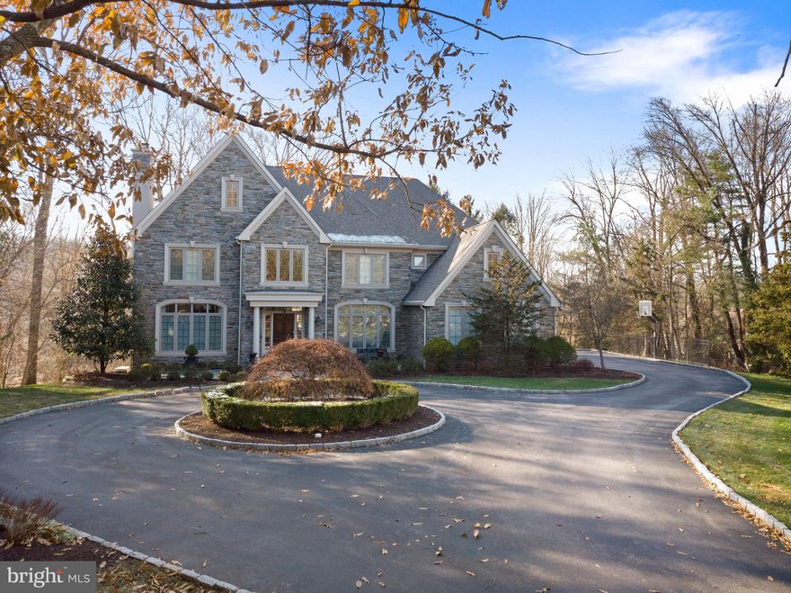 In-person showings available! One-on-one in-person showings are now allowed. Please contact the listing agent to schedule. Virtual tours are also available. The home you've dreamed of comes to life in this 4 bed 5.2 bath Bryn Mawr beauty on lush private grounds at the end of a cul-de-sac street in desirable Radnor Twp. Curb appeal is heightened by a circular drive, lovely landscaping, stone facade, paver walkways, and tasteful architectural touches including a peaked roof line & columned entry. Sprawling treed grounds & peaceful wooded rear views assure optimal privacy. No detail has been overlooked in this warm, inviting abode that s been impeccably upgraded inside & out, and affords a custom open floorplan for comfortable family living & entertaining. The gracious foyer makes an elegant impression with a stately staircase rising to an open landing. High ceilings, extensive custom millwork & wood trim, designer finishes & rich custom hardwoods pour through the main level. Off the foyer is a powder room, and to the left & right, a formal sunken living room with fireplace & spacious dining room with picture windows. Glass-paneled wood doors in the living room open to a wainscoted office with custom bookcases, ideal for working at home & reading the morning paper. A wet bar/butler's pantry connects the dining room & chef's quarters for easy serving when hosting guests. The ultimate gathering spot is the stunning new showstopper kitchen centered by a huge island with seating. Custom cabinetry, a La Cornue range/oven, Wolf wall & steam ovens, 48" Sub-Zero refrigerator & custom walk-in butler's pantry enhance the heart of the home. Enjoy casual meals in the open breakfast room, step out glass doors to the large deck for BBQs & summer parties, or relax in the family room with fireplace flanked by built-ins to watch TV or movies. Rear stairs, a mudroom, garage access & 2nd powder room sit conveniently by the kitchen. The 2nd story covered in plush, high-quality carpeting presents a divine master suite with a vaulted ceilinged bedroom, spacious sitting room & 2 custom-fitted walk-in closets. Your luxurious new spa bath is styled with custom cabinetry, dual sinks, freestanding tub & oversized shower. Three more BR suites offer generous closets with custom built-ins & en-suite baths. Plus there's a 2nd office & laundry room, both with built-ins as well. The carpeted finished basement is great for recreation with a family/media room, open billiards/game area, gym & full bath. Plenty of storage, a 3-car garage & excellent neighborhood near it all make this timeless gem the complete package!