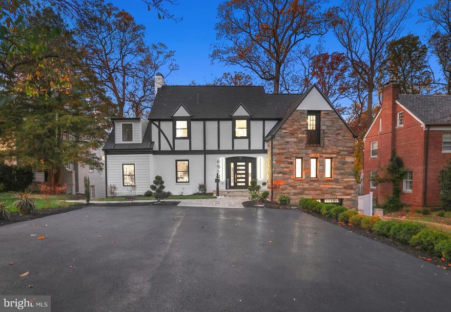 Located in one of the most sought-after neighborhoods in the region, we are proud to present this stunning top-to-bottom renovation by Monumental Construction, in collaboration with the design team at Rising Sun Co. This reimagined classic Tudor has been expanded and meticulously designed, showcasing elegance, modern luxury, and optimal functionality. Every detail has been thought out to ensure the best use of space, and a variety of living options. Upon entrance, you are greeted by a sun-lit foyer and an expansive open floor-plan with gorgeous herring-bone flooring. The gourmet kitchen, with premium appliances and finishes, is nothing short of spectacular. All the bedrooms are bright and spacious, with plenty of customized closet space. The upper level has multiple en-suites, including a breathtaking primary suite,  featuring a spa-style bath and a private terrace with serene tree-top views. The lower level boasts a full kitchen, separate living and dining areas, and its own laundry room, ideal for multigenerational living. There is a garage and enough parking to comfortable fit 5 vehicles. The ultimate entertainment paradise, there are four levels of terraces looking over a massive landscaped backyard with a beautifully designed stone island patio, complete with an outdoor kitchen, and a pickle ball court. Other features include wood-burning fireplaces, dual climate zones, an entry-level en-suite, smart and energy efficient features, an office, and extra storage rooms.