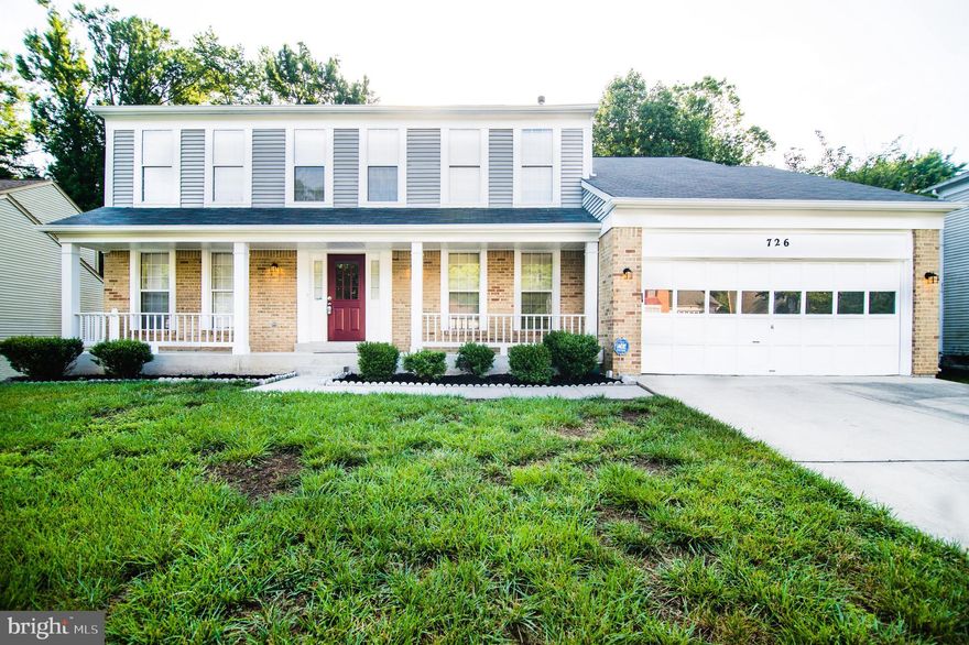 Remarkably spacious and one of the best lots in the community!  This farmhouse style colonial with a covered front porch is move-in ready and spotless.  There is so much space here!  Formal center hall entry foyer leads to the enormous living room on side with a dining room on the other.  There is an updated kitchen with ample cabinet and counter space plus a breakfast room.  The main level family room features a fireplace and private views of the woods.  On the upper level is the master suite with walk-in closet and a full spa-like bath w/soaking tub, separate shower and dual vanity.  There is an adjoining sitting room (or 5th bedroom) in addition to the other bedrooms.  The basement is fully ready to finish with a level walk-out and full windows. Ideal lot backing to trees for privacy.