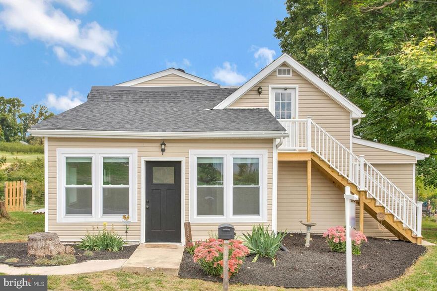 Where in Howard County can you find a single family home full of so much privacy and possibilities?  2985 Florence Road in Woodbine, Maryland is peaceful living at its best!  Enjoy all that the country has to offer while still having the conveniences of shopping, restaurants, entertainment and major highways within easy reach.  Prefer farm stand produce to store bought?  Lariland's pick your own fields are literally walking distance from your front door! Or,  grow it yourself--you have ample space in your own back yard, and, yes,  there is even a chicken coop!   All that awaits is your personal touch throughout this home that has already been upgraded for you.  It boasts a new roof (2020), new siding (2020), new windows (2020 and 2023),  a new ductless heating/air mini split system (2021) and  newer carpet and fresh paint throughout.   A vaulted ceiling greets you as you enter the living room, instantly expanding the space around you.  The large country kitchen is full of light and provides seating or serving at the large center island.  But please don't stay inside long, there is a gorgeous view of an orchard that begs you to come relax and enjoy its unbelievable beauty.  With the main level having a stepless entry,  a roomy primary bed/bath suite with a walk in closet,  and a full sized washer and dryer,  this home provides an opportunity for one level living.  The upstairs offers  two extra bedrooms, a full bath and  a living area complete with its own private entry,  providing yet another unique  opportunity.  You can create a fourth bedroom or add a kitchenette for separate living.  Even the detached  garage is light filled with its sliding patio doors and lends itself to morphing into something other than a roof to simply protect your car from the elements.   Let your imagination make this home truly yours!  Don't let it get away from you, schedule your viewing now!