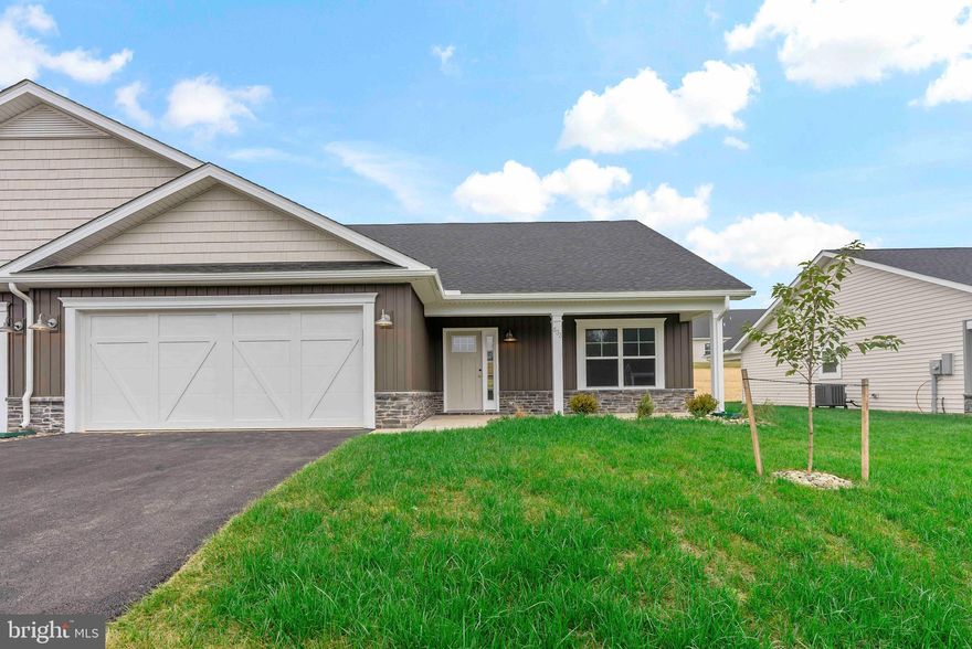 **Pictures are of a similar home - this home will have different selections but is the same floorplan!**
This is the popular Scarlett II model with 3 bedrooms, 3 bathrooms and 2,218 finished square feet.  Low maintenance living with 100% waterproof Luxury Vinyl Plank flooring all through the main living areas, comfort height commodes, and executive height vanities.  The primary bedroom is 16'6" x 15'4" and has a large bathroom and a 5' Walk in Shower, double bowl vanity, linen closet and a 10' x 5.5' walk in closet!  Right outside of this suite is another linen closet and a large laundry room upgraded with a sink and base cabinets.  The kitchen has a 7' island with beautiful quartz countertops, a side and end overhang, and deep drawers perfect for your pots and pans.  The cabinetry is all soft close and the upper cabinets go the whole to the ceiling.  There is a separate pantry, a lazy susan, GE appliances and a ceramic tile backsplash!  Bedroom #2 is at the front of the house with a full bathroom right outside of it as well as a coat closet.  This villa comes with a 3rd bedroom, large walk-in closet and a 3rd full bathroom upstairs!  The upstairs space totals 646 square feet and has endless possibilities!  Guest Room, Movie Room, Sewing Room, you name it! In the garage is the addition of ANOTHER storage closet, and there is an insulated mechanical closet with the water heater, air handler and a water softener bypass system.  The amount of storage in this home is incredible.  Outside, there is a front covered porch as well as an upgraded 12X12 Rear Porch!  Fan Junction boxes have been added throughout in the home, as well as several additional recessed lights.  The home comes with a 1 year builders warranty from Panhandle Homes of Berkeley County and Trane offers a 10 year warranty on the HVAC system.  Construction will be complete Nov. 2024 and ready for you to move in!!  *Pictures include pictures of similar build of the same floorplan, the actual home will have different finishes.