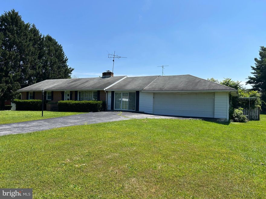 Brick home on lovely 1.25 acre.  Attached 2 car garage.  Home is an excellent location near shopping, hospital, and easy access to Hwy 81.  Enjoy the peaceful countryside. Home is in excellent condition but could use some updating.  A former pool is overgrown but would be a nice deck area with some work.  Home has wood floors  under existing carpeting.  Enjoy the 3 separate living areas, each with a fireplace.  Cozy up to the wood pellet stove insert.  Pool table and ping pong table will stay.  Partially finished basement has outside exit.