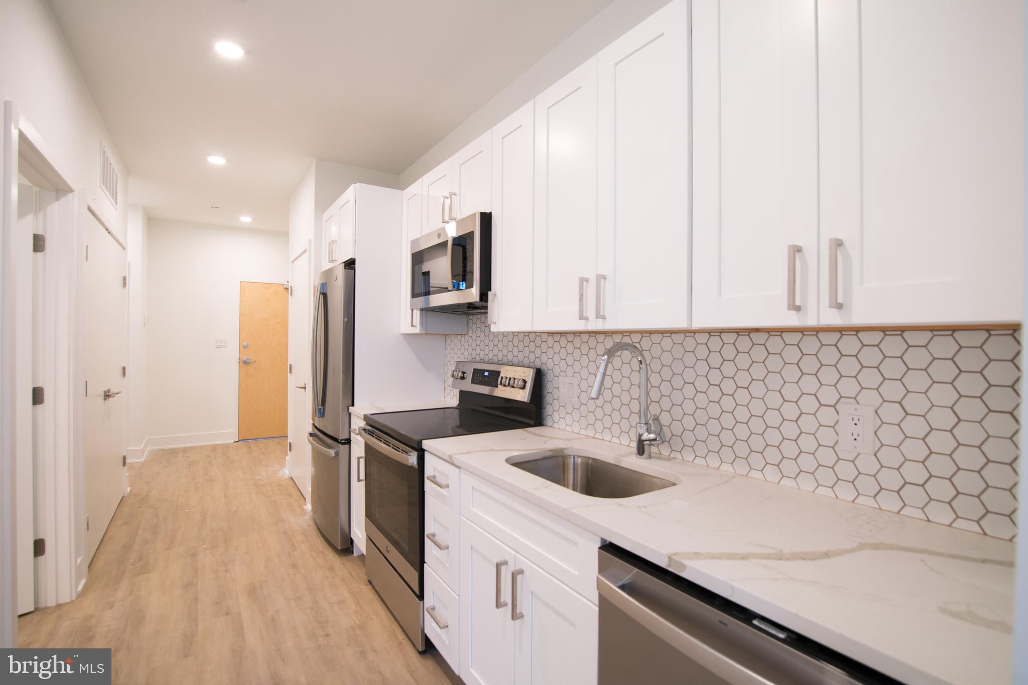 *Available NOW!*
Welcome to 1325 N Lee Street! Located in the trendy Fishtown neighborhood of Philadelphia this beautiful brand new apartment community is the latest addition to the fast growing corridor along Frankford Ave/Front Street and features 20 luxury apartment homes along with first floor commercial space. All units showcase design driven high end finishes, abundant space and access to excellent communal amenities – as well as Central Air/Heat and In-Unit Washers/Dryers. Upon entering any of the apartment homes you are welcomed with an abundance of natural light flowing through large windows in the open-concept kitchen, living space and bedrooms. Kitchens are equipped with plenty of countertop and cabinet space, modern tile backsplashes, stainless steel appliances, and gorgeous hardwood flooring throughout. Generous living areas host large windows and plenty of space for your furniture or home office space. Bedrooms will comfortably fit a queen sized bed and offer plentiful closet space! The stunning bathroom spaces feature designer tile in the tub/shower combos beautifully accenting the finishes throughout this space. Finally, on top of it all, the building also offers a spacious communal roof deck with a sweeping view reaching all the way to the center city skyline! Conveniently located close to everything Fishtown has to offer, including the Market-Frankford Subway, Area Highways, & tons of local hop cafe’s, restaurants, and breweries. The famous Pizzeria Beddia is even just across the street! Don’t miss your opportunity to be a part of this exceptional apartment community. Schedule a tour with our agents today and discover your new haven in Fishtown!
Lease Terms: Generally, 1st month, and 1 month security deposit due at, or prior to, lease signing. Other terms may be required by Landlord such as last month’s rent upfront. $65 application fee per applicant. Tenants are responsible for: electricity, gas (if applicable), cable/internet and $10/mo technology fee. Water is a flat monthly fee of $60. Additional fees or requirements may be applicable for units with Homeowners or Condo Associations. Landlord Requirements: Applicants to make 3x the monthly rent in verifiable gross income, credit history to be considered, no evictions within the past 5 years, and must have a verifiable rental history with on-time rental payments. Exceptions to this criteria may exist under the law and will be considered. Cosigners will be considered.
*Price reflects the net effective rent after a 6-week credit is applied at $1,550/mo.
*Dogs under 35lbs permitted with owner approval. $50/mo pet rent required.
*Photos of multiple units in the building. Finishes will match, layouts may vary.