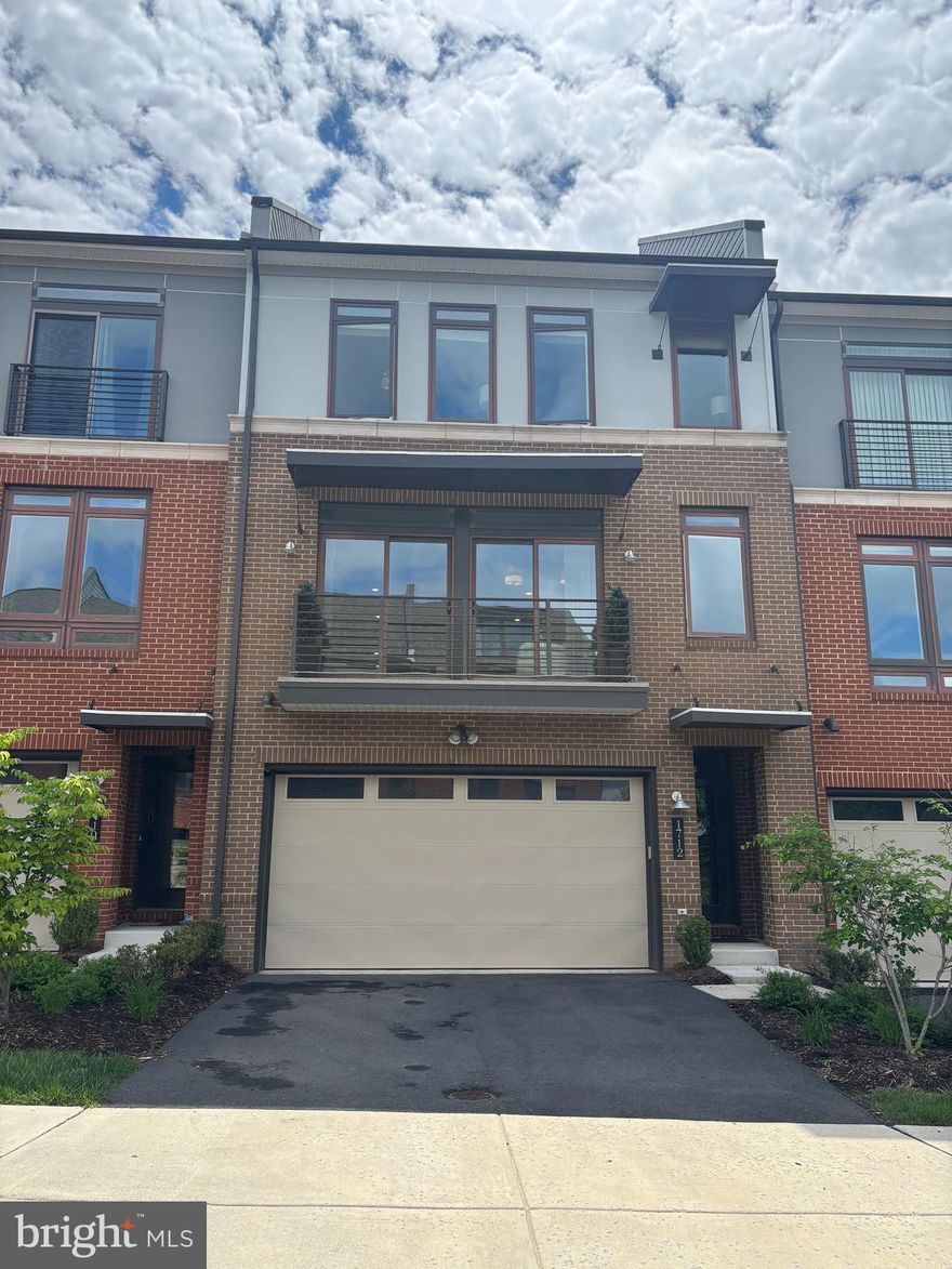 Immaculate & better than new 2 car garage, modern townhome. Absolutely stunning interior. Hardwood floors throughout. Gourmet kitchen on main level features an enormous center island (perfect for entertaining), Shaker cabinets, quartz countertops, stainless steel appliances, subway-tile backsplash and pendant lighting. Main level also has a very spacious family room with gas fireplace, two decks (front & rear), and an open floorplan concept that creates a very light & airy feel. Hardwood flooring extends to the upper level - which has 3 large bedrooms and 2 full baths. Huge master suite includes two walk-in closets, luxury bath with 12" ceramic tile flooring, dual vanity sinks, quartz countertops, soaking tub and heavy glass shower enclosure. Upper level hall bath has ceramic tile flooring and dual vanity sinks. Full walkout lower level is fully finished with 3rd full bath. Fantastic location - quick & easy walk to Wegmans and all of the stores at Village at Leesburg. Convenient to Rt 7, Loudoun County Parkway, Battlefield Pkwy, Rt 15, and Dulles Toll Rd. 5 minute drive to the heart of historic downtown Leesburg!