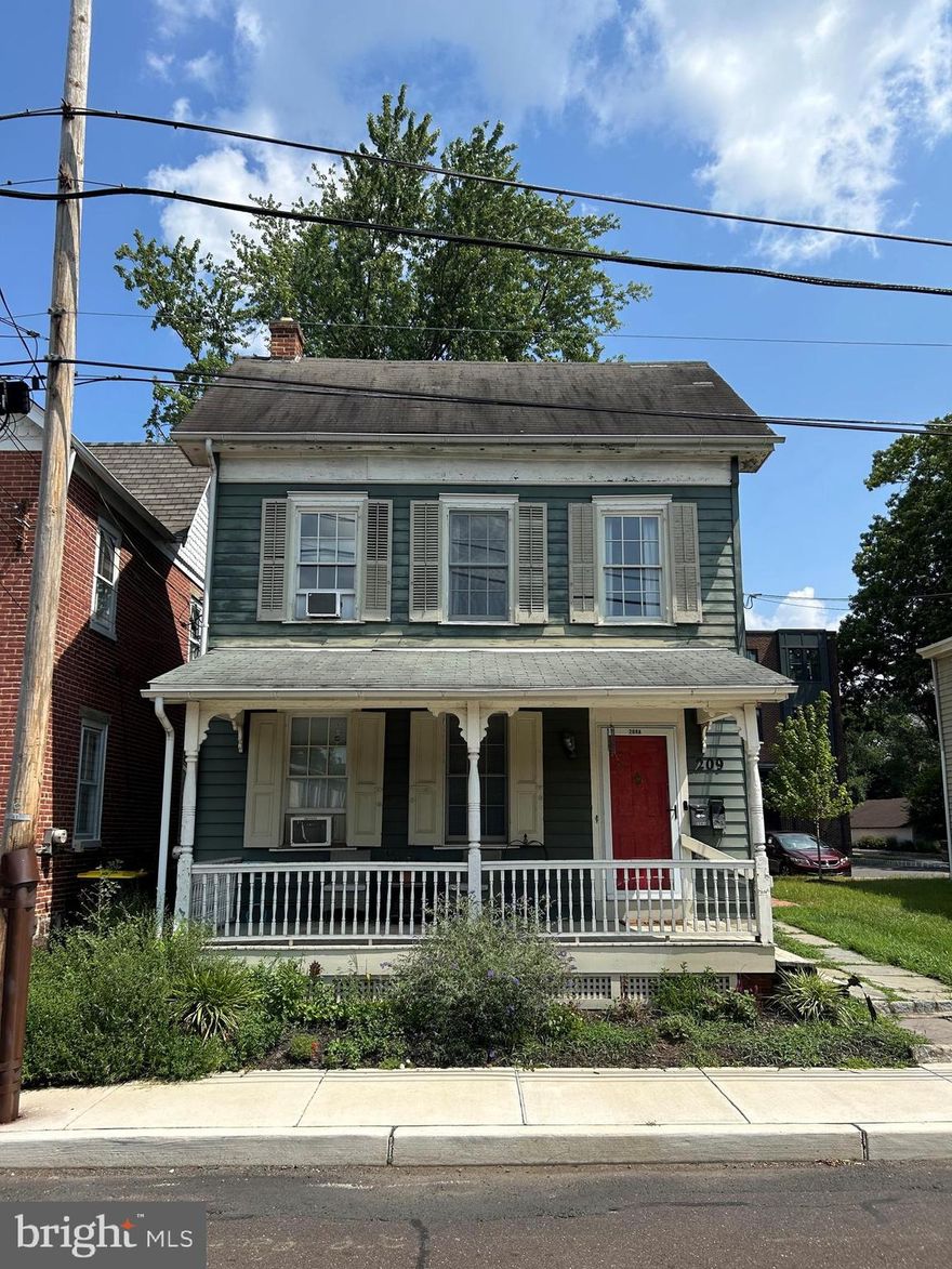 Location Location! Great opportunity to own your own piece Bucks County history in the exceptional community of Court & State! Charming, 100+ year old 2 1/2 story Colonial gem on Court Street in Newtown Borough.  Currently, the first floor consists of a one bedroom apartment with kitchen, den, full bathroom, bedroom, study area and basement. The second floor is also a 1 bedroom apartment currently with kitchen, full bath, living room and den. There is also potential for lifting the roof and expanding back as other properties have done nearby. This is subject to approvals by Newtown Borough authorities, HARB and the HOA at Court & State. There is also an adorable front porch too! This home is part of the Newtown's luxury townhouse community, Court & State that includes 4 artisan homes which are a modern splendor with historic charm located at 215 S State Street in front of Court Street and an additional 8 townhomes located behind Court Street on Thornton Lane. This sub division IS NEARLY COMPLETED  with a  total 12 new luxury townhomes including two historic single family homes located at 209 & 211 Court Street. Enjoy living in the main commercial thoroughfare boasting wide sidewalks, charming shops, taverns, and bustling restaurants. How special it would be to live within the center of the Newtown shopping district. There are two designated parking spaces for this unit located in the parking lot behind the home. The sub divisions landscaping and beautiful brick sidewalks should be completed in the spring.