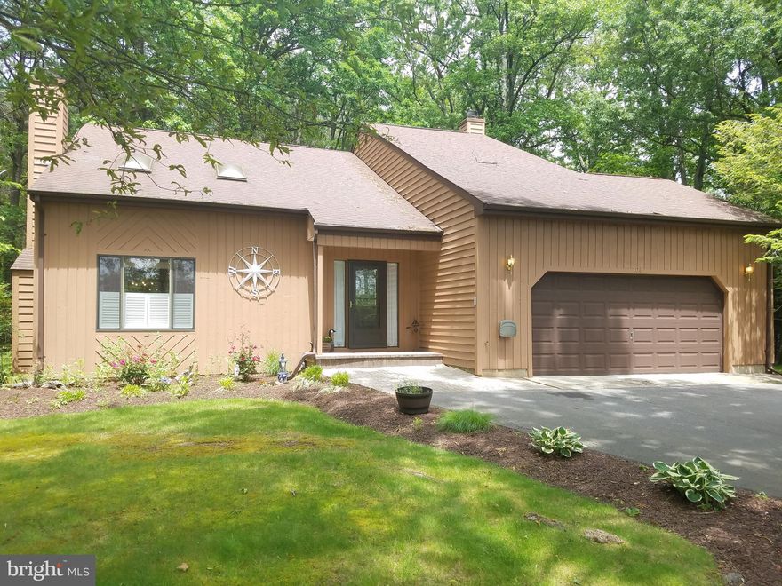 Best Value in Neighborhood!!Coastal Contemporary, 2,000 sq. ft. home on private 1/2 acre beautifully landscaped level lot.    This 3 Bedroom, 2.5 Bath,  2 car garage home is well cared for and move-in ready!  Living room features cathedral ceiling with skylights and fireplace; dining room with custom molding;  kitchen with center island and granite countertops; luxury vinyl plank flooring throughout foyer, dining room,  kitchen and family room; large airy sunroom (40 x 10) perfect for entertaining with walkout to patio and large private yard.    Great location with Blue Heron Golf Course across street and minutes to Queen Anne Marina.