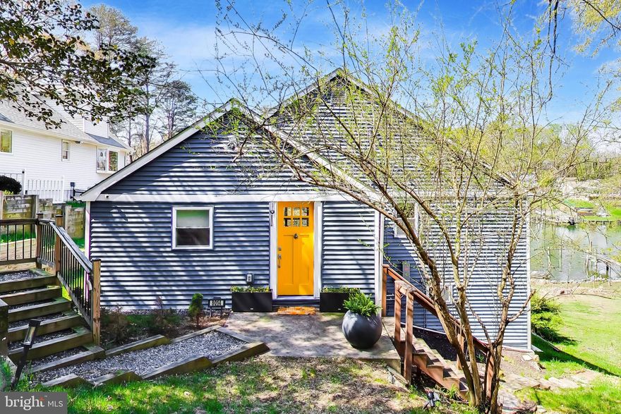 Tucked away on Mathias Cove in Forest Glen, this peaceful waterfront property offers a private retreat with views that instantly draw you in. From the moment you enter, the home’s inviting layout and thoughtful updates create a warm, welcoming feel. The renovated kitchen flows seamlessly into a spacious great room with vaulted ceilings, abundant natural light, and warm hardwood floors.

Large sliding glass doors open to an expansive covered deck overlooking the water—perfect for outdoor dining, entertaining, or simply relaxing on a summer afternoon. The functional kitchen combines timeless and modern elements, featuring stainless steel appliances and granite countertops. 

The open-concept living and dining areas offer versatility for a variety of layouts, while the covered deck easily accommodates both seating and dining spaces. The primary bedroom captures beautiful water views through a large picture window, creating a peaceful start to each day. Dual closets provide ample storage, and the attached bathroom includes a walk-in tiled shower with updated fixtures. A second bedroom and an additional full bath with stylish finishes complete the main level.

On the lower level, a comfortable family room gives you direct access to the backyard and waterfront. A utility room has been upgraded with a work sink and front-loading washer and dryer for added convenience. 

The outdoor setting truly sets this property apart, offering an exceptional waterfront lifestyle along the Chesapeake Bay. In summer 2024, the shoreline underwent a significant restoration designed with a landscape architect, incorporating hand-placed boulders to enhance both stability and aesthetics. At the same time, the pier was fully rebuilt to provide deep-water access, complete with new pilings, updated decking, and a large slip. Electricity and plumbing were added along with 100-amp service and a custom International Dock pedestal. A High Tide Jet Ski lift with dedicated power was also installed, along with three new water connections. Custom Hubbardton Forge lighting, controlled by a Lutron timer system, illuminates the pier in the evening creating the perfect vibe. Upgrades continue with a French drain system to support proper water management. 

This is a rare opportunity to own a distinctive waterfront home where the major improvements have already been completed—ready for you to move in and enjoy everything life on the water has to offer.