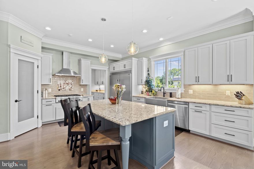 Luxury living meets cozy charm... This custom-built home offers the rare opportunity of main level living, with the Primary Bedroom and one set of washers and driers on the entry level. Better than new construction, this 7-year-young custom beauty has what many new construction homes do not: a level, lush acre of land with mature landscaping and thick, leafy green grass and a mostly finished basement with a bit of customizable area, perfect for an exercise room and/or a media room (currently part of the unfinished area houses a greenhouse!). It appraised for $1,750,000 in 2022 and since then the numerous upgrades throughout the home simply add to its specialness. As a new house, it was built with top-notch design elements and materials, and in the past two years, more thoughtful work has been done. About $150,000 in upgrades which include designer lighting fixtures (the Murano glass chandelier over the kitchen table is stunning) and ceiling fans, refinished wood floors, a new paver front walk and repaved driveway, a top-of-the-line security system, the latest and greatest garage door openers, an EV charger, LED lightbulbs throughout and, last but not least, solar panels. Take the stunning custom craftsmanship of this beautiful home, add all of these recent upgrades from the past two years, and you have the perfect new home awaiting you. And unlike so much of the new construction in northern Virginia, this home has so much yard! You have a full front yard and an outfield of a backyard, a full acre of land and perfect outdoor spaces - an expansive front porch and a huge back deck - from which to enjoy the bucolic views. Inside the house, the outside streams in - sunny and bright throughout the day. The main floor is so welcoming, with spaces open and flowing, but with boundaries that create coziness. And the main floor Primary Suite and laundry room make this the perfect home in which to not do stairs if you don’t want to! But you won’t want to miss the three large ensuite bedrooms/bathrooms on the second floor (and the second laundry room), nor the Rec Room, wet bar with beverage fridge, entertainment zone, the fifth bedroom and fifth full bath that you will find in the basement. Full of design, details, finishes, upgrades, and room for life to unfold, this house is the perfect home. The perfect home in the perfect place in the acclaimed Woodson school pyramid. It is so close to everything (4 minutes drive via back roads to Wegmans!!!), with easy access to major thoroughfares, shopping and dining, yet, when you are home, you will feel as though you live in a small rural community, where life moves slowly and you are rooted in your land. What’s not to love? There is a ring doorbell in use. The last three photos are concept photos to show the house with different exterior colors.