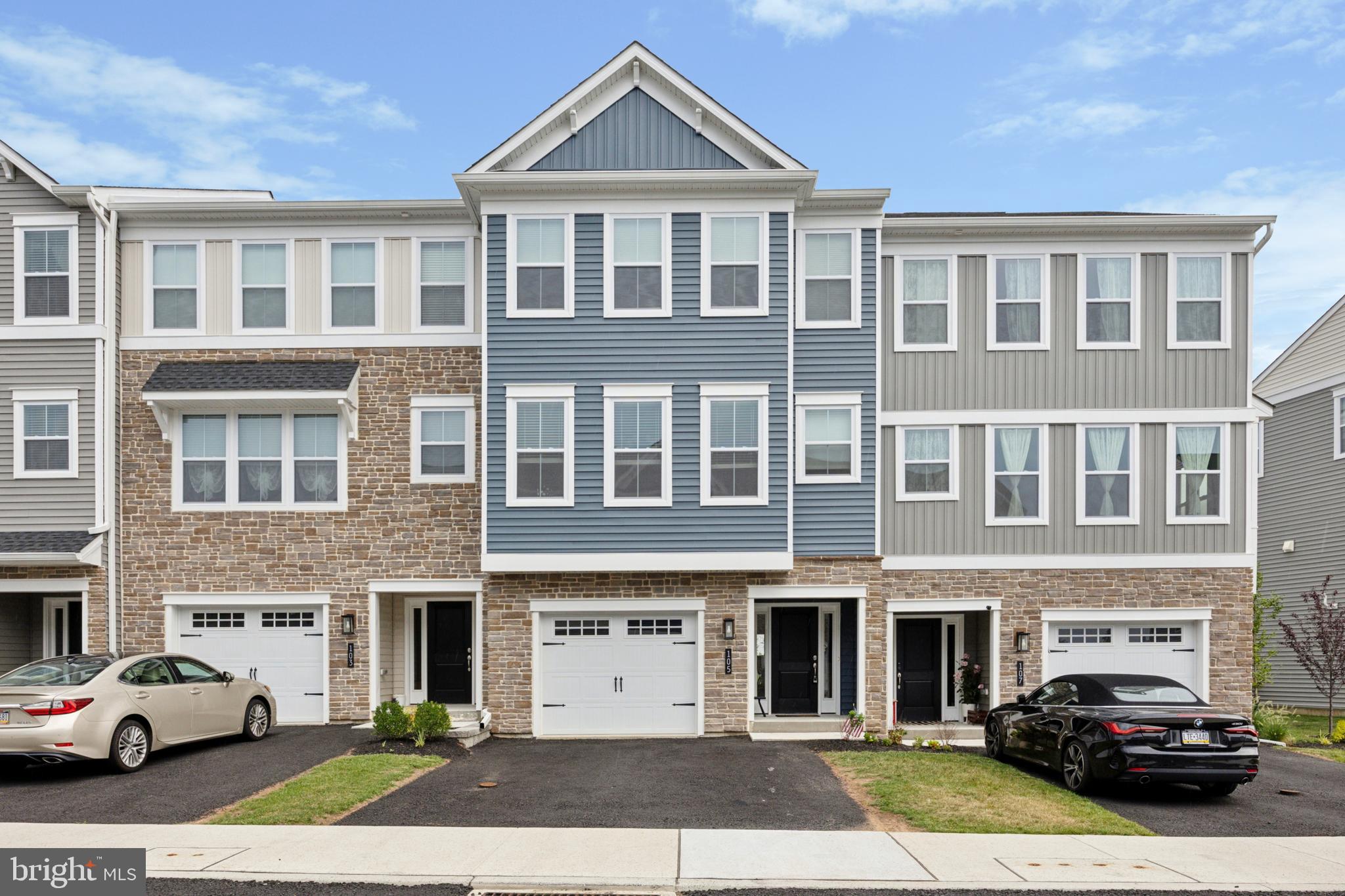 Welcome to 105 Higher Rock Court – where luxury, comfort, and convenience come together in one of the largest and most sought-after models in the neighborhood, the Warwick by WB Homes. Built just a year ago, this thoughtfully upgraded home offers modern finishes and spacious living across three beautifully designed levels. From the moment you enter, you'll notice the wide plank hardwood floors, upgraded crown molding, and abundant natural light flowing through the open-concept main living space. The heart of the home is the gourmet kitchen, featuring GE’s upgraded appliance package, a generously sized island with pendant lighting, and a custom tile backsplash that adds the perfect finishing touch. Upstairs, the primary suite is a true retreat with enhanced lighting and luxurious finishes, while all bedrooms are outfitted with plush, extra-padded carpeting for ultimate comfort. The tile work continues in the bathrooms, giving them a clean and sophisticated feel. Step outside to enjoy not one, but two outdoor living spaces—a full Trex deck off the main floor and a spacious patio on the lower level—ideal for relaxing or entertaining. Located in a prime North Wales location, you’re just minutes from top shopping destinations, dining, and major roadways including Routes 309, 202, and the PA Turnpike. This is your chance to own a nearly new, upgraded home in a highly desirable community—schedule your tour today!