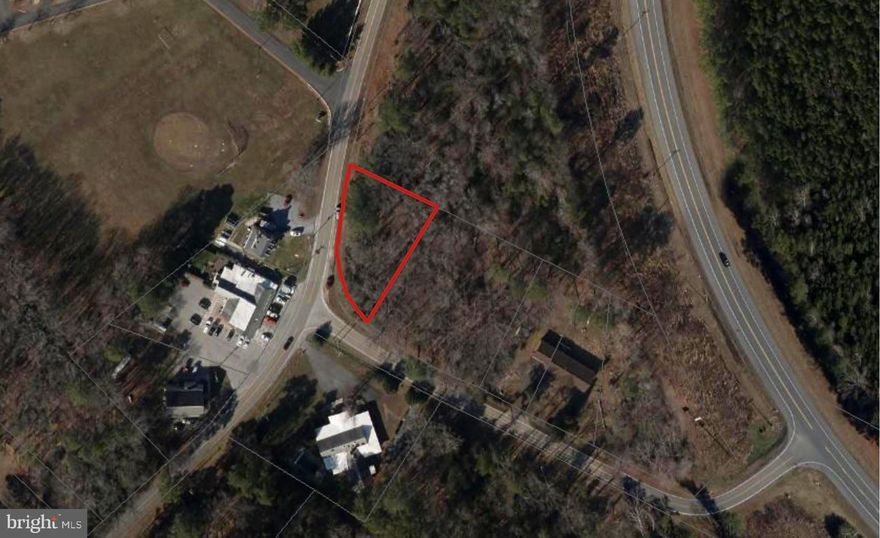Corner lot on Tall Timbers Rd across from WJ Dents & Son Country Store. County has confirmed public sewer hook-up is available and private well is required. Buyer is responsible for doing their own due diligence.