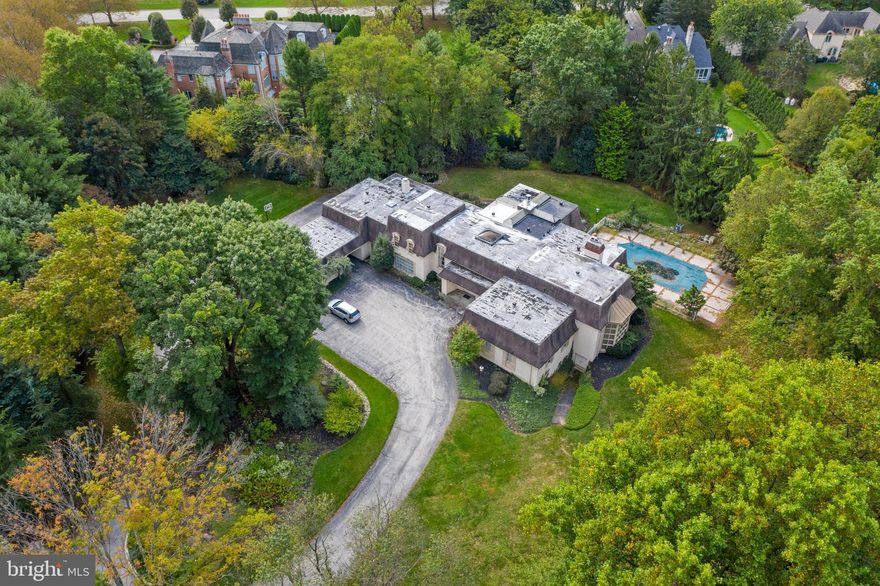 Rare land/renovation/build opportunity in prime Bryn Mawr! Live the dream and take advantage of this fantastic offering, to create your own custom-designed estate home on a beautiful level, fenced and gated 2.25-acre lot. Property like this, of such generous proportion, on one of the most valuable and coveted streets on the Main Line, only comes along once in a lifetime   with lush gardens in bloom, a swimming pool and pond, all surrounded by mature trees for optimal privacy. The existing 5 bedroom 5.2 bath home that currently sits on the grounds can be completely redone to your vision, or build a brand new showplace that meets the exacting standards of your family s lifestyle and needs. Yet the real prize is the sprawling land, and the incomparable location, which is very quiet, yet conveniently close to all amenities and major routes. Don t miss your chance to experience the potential of this prized Main Line property, and make it yours!