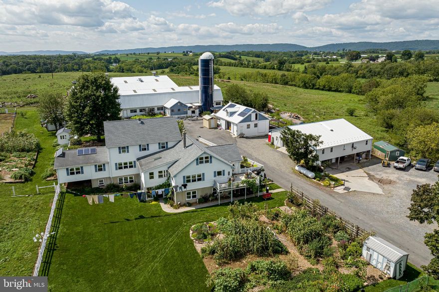 100-acre operational dairy farm with 85 acres of fenced in pasture, 5 of which are wooded pasture. 70 acres could be used as tillable ground. All acres are certifiably organic. There are multiple outbuildings, all in very good condition. The dairy barn has 49 tie stalls, the attached horse barn has5 large stalls, and there is 7,900 SF+- on the upper level of the bank barn. Other outbuildings include a two-story 40x35 work shop with a 10x30 lean to, a two-story bank barn with finished office / business spaces on the upper level and a 4-stall horse barn on the lower level. There are additional sheds / garages. The farm house is a 6,000+ SF double house. One house is approximately 3,500 SF with 5 bedrooms and 2 full bathrooms. The other house is approximately 2,000 SF with 4 bedrooms and 1 full bathroom. There is also a 1 bedroom, 1 bathroom apartment in the lower walk-out level with a full kitchen. There is an additional full kitchen in the other side of the lower level and a large open unfinished area. In front of the double house is a large spring fed pond. The Iveco diesel, 3 above-grade propane tanks, air and fan systems, milking system, 10,000-gal milk tank, and solar system are negotiable. The existing dairy herd and A2A2 milk contract are also available for sale.
