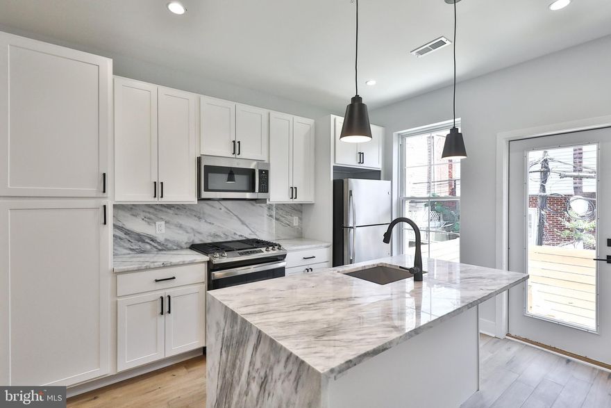 *AVAILABLE SEPTEMBER 1st*  Introducing 2011 S Garnet Street, a newly constructed home located in the West Passyunk neighborhood of Philadelphia. This home, built in 2021, is a 1,500 sqft property featuring 3 bedrooms and 2 bathrooms, situated on a quiet street. Upon entering, you will immediately notice the meticulous attention to detail that defines this home. The spacious living and dining area offers an open floor plan with elegant hardwood flooring. The kitchen is equipped with a large island, beautiful cabinetry, stainless steel appliances, and ample storage. From the kitchen, you can access the inviting backyard, perfect for grilling. Upstairs, the guest bedroom provides ample closet space, while the master bedroom offers enough room for a king-size bed. In the hallway, there is a full bathroom with a shower featuring high-end finishes and a double vanity. Head up to the rooftop deck and enjoy plenty of exterior lighting, along with access to water and electric, allowing you to enjoy panoramic views of downtown Center City, the Stadium Complex, and University City. The basement features a full bathroom with a tub/shower, as well as a third bedroom with plenty of natural lighting. For more information, please contact the listing agent.