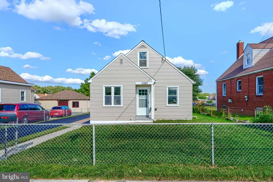 Beautifully remodeled 5BR/2BA home with brand new asphalt driveway and detached oversized garage.  Enter this home at from your private 90' driveway into a sundrenched oasis. The main level features an all new kitchen with island, white shaker cabinetry, pendant lighting, and new stainless steel appliances.  There is a dining space as well as a gorgeous living room with accent wall. The main level offers recessed lighting and masterfully refinished original hardwood floors. Meander down the hallway to find 2 main level bedrooms and the fully remodeled bathroom with tub-shower combo and all new ceramic tile. The upper level offers new plush carpet and 2 more ample bedrooms with recessed lighting. The newly finished basement level provides endless opportunities for customization. It features luxury vinyl plank, a new waterproofing system connected to sump, the second full bathroom and the 5th bedroom. The bedroom offers a convenient walkout to the covered rear porch which includes fan/light combination. The fully fenced rear yard is luscious and spacious. The oversized 20x25 garage with electric provides vehicle storage, workshop potential, or awaits your home gym/creative  ideas. A garage door with motor will be installed with a planned installation date of October 10. This property has been painted throughout both interior and exterior. If offers all new HVAC with brand new high efficiency furnace and condenser. Come have a look at this gorgeous home before it's gone!