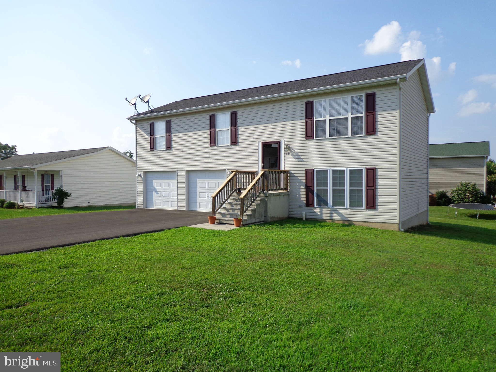 Split Foyer located north of Martinsburg and convenient to Spring Mills area. Home has been tastefully upgraded with warm decorator colors in all rooms. Large Family Room and 2 car garage on first floor. Living room, Dining room and Kitchen are one Huge room!