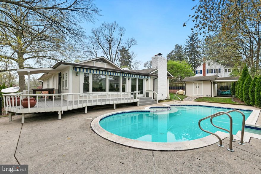 Beautifully landscaped 3BR/4BA rancher tucked on a quiet cul-de-sac with exceptional indoor-outdoor living. Originally built by a builder for his own residence, the home offers thoughtful design, abundant natural light, and numerous updates throughout. Renovated kitchen with quartz countertops, stainless steel appliances, gas cooking, skylight, soft-close cabinetry, and an impressive 12-foot island with breakfast bar. Cozy sitting area with all-brick wood-burning fireplace. Stunning sunroom opens to a freshly painted wraparound deck overlooking the fully fenced backyard with built-in pool, Jacuzzi, and pool house with full bath—perfect for entertaining. Main-level primary suite with en-suite bath, dual closets, and convenient laundry. Fully finished lower level with recreation room, guest room, full bath, second laundry, and walk-up to the yard. Expansive driveway fits 6–7 cars plus carport. Numerous updates including HVAC, newer windows (2017), chimney pointing, and added attic insulation. Ideally located minutes to Downtown Silver Spring, Metro, MARC, Rock Creek Park, Sligo Creek Trail, I-495, and major commuter routes into DC and Bethesda.  Mortgage savings may be available for buyers of this listing. ***Back On Market***  Discovered buried oil tank Seller was unaware of as it was not disclosed by the previous owner.  After learning this, the current seller had the tank removed by a professional environmental company and all is well with all documentation provided in Disclosures.