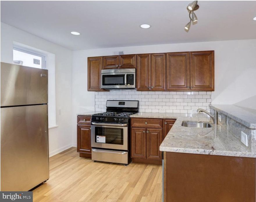 Live at 2002 N 4th St #1, a well-appointed 2-bedroom, 1-bathroom apartment in the heart of Norris Square. This home features central air, in-unit laundry, and a sleek kitchen with stainless steel appliances. Enjoy the added storage space of an unfinished basement. Conveniently located near public transportation, parks, and local dining.

Schedule your tour today!