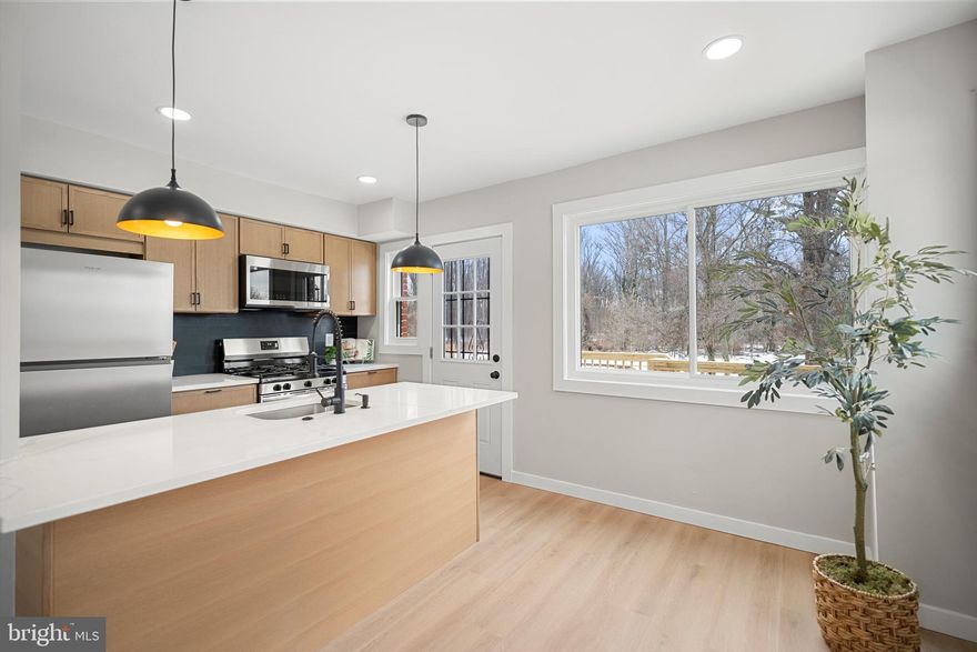 Welcome to this Fully Remodeled corner unit home, thoughtfully redesigned by a reputable designer where nothing was overlooked. This charming two bedroom, two bathroom residence blends modern updates with everyday comfort and functionality. Lower level room can be used as a third bedroom.
Step inside to an inviting open floor plan filled with natural light, highlighting brand new flooring, fresh paint, and seamless flow between the living, dining, and kitchen areas. The fully remodeled kitchen features new cabinetry, countertops, stainless steel appliances, and gas cooking.
The home offers a finished basement with a full bathroom and a separate private entrance, making it ideal for an additional bedroom suite, private office, guest space, man cave, or potential additional income.
Major upgrades include new windows, new roof, new deck and fence, new HVAC system, new water heater, and new electrical panel, offering true peace of mind. 
Outside, enjoy exceptional privacy. This is the only home backing directly to a park, ensuring permanent open views with no future construction and no neighbors behind you. A brand new oversized deck, fully fenced yard, and large shed create the perfect setting for entertaining or relaxing. Hosting is easy with ample parking available, even for larger gatherings.
Prime location just five minutes to West Hyattsville Metro, walking distance to Metrobus, close to downtown Hyattsville, Aldi, Lidl, parks, shops, and restaurants, with easy access to Washington, D.C.
This home is truly move in ready, private, and thoughtfully upgraded, offering an ideal place to live.
The property requires flood insurance.