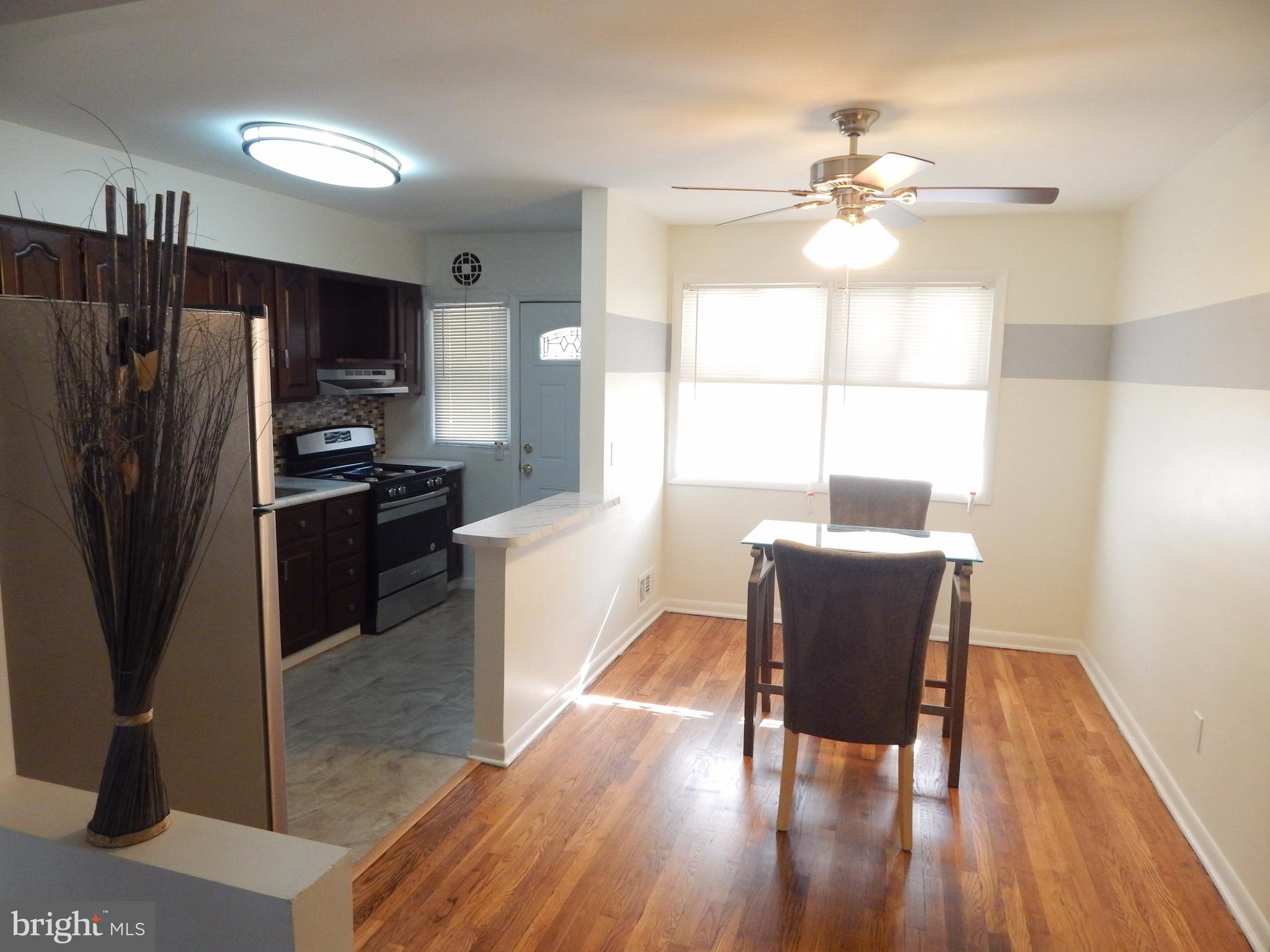 Newly updated, porch-front townhome. Newly refinished wood flrs. Gorgeous updated kitchen has striking new glass backsplash, new ceramic tile flr, new countertops & breakfast bar, & new stainless steel appliances. Remodeled bathrm w new tub, vanity, toilet, mirror, new ceramic tile flr & surround. Finished bsmnt w/ fam rm, new carpet, bar, 1/2 bath, laundry w/ washer & dryer. Covered front porch.