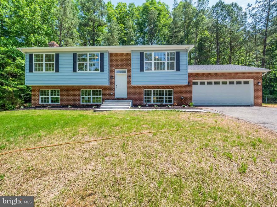 Move-in ready is an understatement here!  This home has been completely rebuilt and almost everything is completely new!  Granite counters, fresh paint, wood floors, you name it, this home has it!