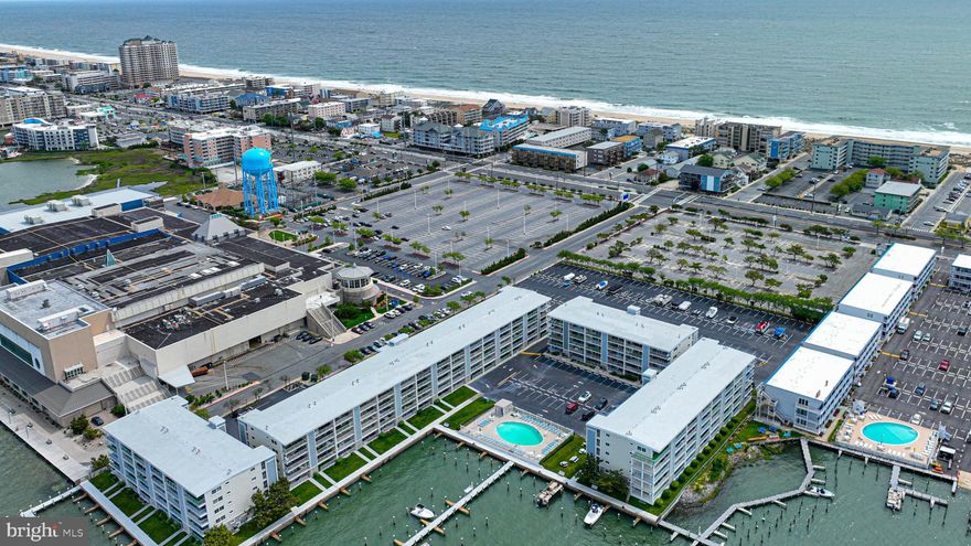 Sought after Thunder Island.   Enjoy lounging on your patio or by the bayside  pool. Boat slips on a first come basis but shouldn’t be an issue getting one for the season.  This property just needs updating,  but WOW the view is all worth it! and enjoy it for yourself or as an investment property!  Being SOLD "As Is". Short walk to the beach and close to so many area restaurants, nightly entertainment and shopping.  You can walk to Seacrets or jump on the bus and never have to move your car.  Located next to the Convention Center on the bay.