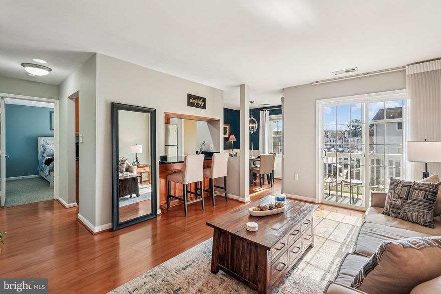 Welcome to this delightful 2-bedroom end-unit condominium that perfectly blends charm, comfort, and convenience. Nestled in a quiet, wooded neighborhood with beautifully upgraded landscaping—including new retaining walls throughout—this home offers peaceful living just minutes from Reston, historic Leesburg, Tysons Corner, and the scenic wine country of western Loudoun as well as Dulles Airport, and metro rail and bus commuter routes. Step inside to discover luxury vinyl flooring in the common areas, a spacious living room filled with natural light, and a separate dining room ideal for entertaining. The kitchen features a cozy bar for casual meals and conversation, while the full bath and dedicated laundry room add everyday practicality. Though modest in size, this condo feels roomy thanks to its smart layout and abundant storage—including a generous storage closet and multiple built-ins. Enjoy your morning coffee or evening unwind on the private balcony, surrounded by mature trees and tranquility. Whether you're a first-time buyer, downsizer, or looking for a peaceful retreat close to shopping and commuter routes, this sweet condo is a must-see!