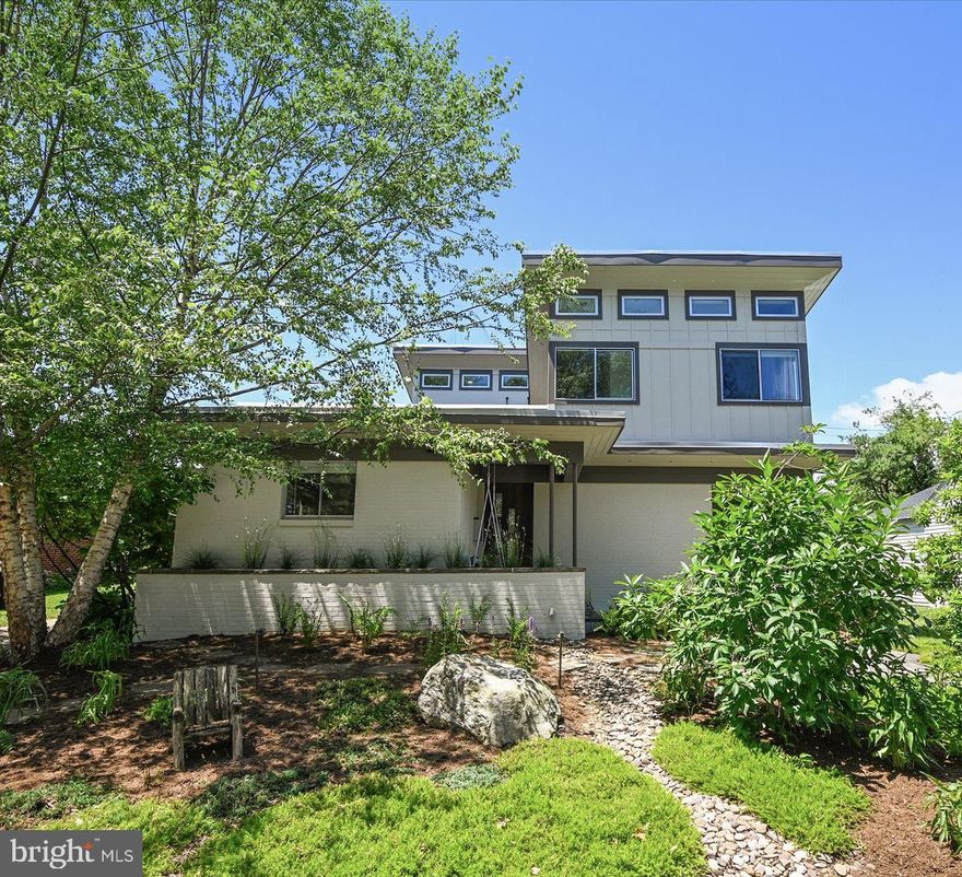 MOTIVATED Sellers and a price adjustment that can't be beat for 2600 sq. ft of finished living space featuring an incredible main level renovation and new kitchen completed in 2021.

This is your chance to enjoy wide open living spaces in a large home with great natural light while living in Murray Hill, a few minutes stroll to historic downtown.  Stop the car, get off your bike, pause the rented bird scooter and come inside to see what this house really has to offer!!

Vaulted ceilings, a floating staircase and a bright new kitchen with a true open floor plan is a rare find in Murray Hill.   This contemporary home has undergone the perfect renovation, resulting in a wonderful space for family gatherings and entertaining.  The mid-century vibe starts at the entry with a unique floating staircase and custom iron railings.  Beautifully finished hardwood floors are flooded with light from the transom windows high above. The lovely white kitchen opens to a  dining room and large family room overlooking a perfectly landscaped back yard.  The main level bedroom is located off the kitchen, and currently used as a home office.  French doors lead to a stone patio featuring a waterfall pond with boulders and mature plantings built into the garden slope.  Natural stone steps flow to a generous yard with raised garden beds and a fantastic shed & workshop with electricity and lighting.    A screened patio off the kitchen and dining room is great additional outdoor entertaining space.  

Upstairs you will find two large bedrooms both with en suite bathrooms.   The light filled primary suite is large enough to have it's own seating area.  Vaulted ceilings again provide incredible natural light and sense of space. The walk in closet has custom built in storage and leads to the primary bathroom with dual sinks and a large shower.  
The second large bedroom upstairs also has an ensuite bath with a charming clawfoot tub.  


The basement is accessed by an interior staircase with plentiful storage space, good ceiling height, and could be finished if desired.  The basement houses the Geo-Thermal heating/cooling system, a tankless water heater and an additional washer/dryer hookup with utility sink.

This home is surrounded by remarkable landscaping and has great curb appeal.  The stone walkway leads you to the unique covered entry with its cool built in planter box and a porch swing that invites you to linger.  The home offers a driveway with parking for 2 cars, and a convenient side entry leading directly to the kitchen.  An additional driveway on Amos Garret boulevard includes a car charging station and is accessed by a privacy gate at the rear of the property.   Kayaks or paddle boards can be easily rolled a block to be launched from the pier at  Amos Garret Park.  There are multiple street end pocket parks within 2-3 blocks of the home offering community piers and water access to Spa Creek.   And of course this location offers you the community and walkability that everyone desires, and an easy stroll to dining on West Street and all of downtown Annapolis.