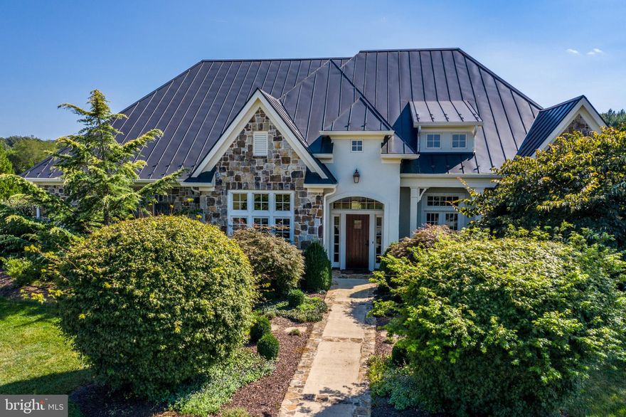 Erchless - a stunning custom home situated on 53.32 acres in Clarke County was built by Ritter construction in 2007-2008.  Combining a contemporary open floor plan with traditional details - - 12 - 16 foot ceilings, crown molding, solid hardwood doors, custom hardware, beautiful stone exterior, hardwood floors and custom finishings this home is exquisite - leaving no detail unfinished.

Enter this home through a custom hardwood door to a gorgeous foyer,  you are invited to a charming library with custom built-ins on your right, a formal dining room to your left with attached wet bar.  Continue down the foyer to a large open family room perfect for entertaining.  The family room, kitchen and large sunroom take up half of the main level open to much natural light and beautiful views of open pasture and the Blue Ridge Mountains.

The kitchen is a entertainers delight - Subzero double refrigerator, GE Monogram double wall ovens, GE Profile built-in microwave, compartmental built-in warming drawer, Wolf 4 Burner gas range with center griddle and custom exhaust, GE Profile dishwasher, double sink, second sink, disposal.  Granite counters surround and custom cork floors, top of the line cabinets.  Kitchen opens to a separate dining area and large sunroom with super views and natural light.

Main level Master Suite with sitting room, office, walk in and walk through closet, large bath with walk-in shower and soaking tub, gas fireplace with remote is privately located in the back of the house.  Large, open and light-filled this area is peaceful with beautiful views.  Two more bedrooms are located on the main level with a full bath.

The lower level of this gracious home is also built for entertaining, an in-law suite, or a nanny living area - very versatile - 3000+ square feet built above grade, tons of natural light.  Open with large rooms.  Full bath, galley kitchen, dining area. exercise room or bedroom.  All opens to lower patio socializing space.  HVAC room houses geothermal heating system, two furnaces, water treatment system, air purification system, 2 hot water heaters, and a utility sink.  Also has loads of dry, temperature regulated storage.

The upper level of Erchless is a large walk-in attic accessed by a stairway from the laundry room - approximately 2000 sq. ft.  It has plenty of dry storage and a large walk-in cedar closet.  

The home also has a large garage attached with entrances to the house via the laundry/mudroom and the wet bar.  Laundry room/mudroom has direct access to kitchen area.  Generator powered by 800 gallon propane tank power kitchen, well, heating system in case of power shortage.

The surrounding 53.32 acres is in great condition - hay has been made on this property for the past 25 years.  The back 10 acre strip has been planted in alfalfa and the farmer will be able to harvest it until the end of 2023.  A potentially perfect horse property.  Property is in VOF conservation easement.  Building of barns and agricultural buildings permitted.  The building of an indoor arena also permitted with VOF approval of site.  There are no additional DURs.   Please call showing agent to view or show.  24 hour notice and NO Showing time.