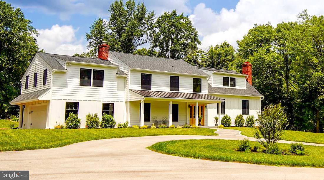 ASK YOURSELF THE QUESTION, WHAT IF MY GETAWAY PLACE WAS HOME? This custom retreat has been designed to capture the natural beauty of this iconic location. Enjoy 4 private acres, zoned for horses, surrounded by horse trails and Conservancy Lands in Willistown Township. Experience the serenity of this property while accessing major corporate centers, schools, entertainment, shopping and the train. The airport is only a convenient thirty-minute drive. Legendary Radnor Hunt Club and White Manor Country Club offer riding, golf, tennis and wonderful social opportunities nearby. In 2017, renowned local architect Stephen Foley of Wayne designed the plan for the renovation and expansion that transformed a split level into the multi-level, mid-century modern residence that it is today. The exterior result boasts James Hardie Plank Siding, Anderson 400 Series high efficiency and over-sized black windows and new shingle and metal accent roofing. The driveway was also extended and a circular approach was created to access the new flagstone covered front porch. As an integral part of this project all of the mechanical systems were replaced. The project included adding high efficiency HVAC units, replacing the electrical, plumbing and alarm systems; as well as a new hot water heater. The new home's modern kitchen is appointed with custom cabinetry, a suite of stainless-steel Kitchen Aid appliances, Italian porcelain floor tile, white quartz countertops, glass backsplash, a stunning farm sink, an island and breakfast bar. The gourmet kitchen flows into a dining room with a marble fireplace that accommodates a cozy dinner or large formal meal. A generous and welcoming gathering place awaits in the great room, with its stone wall and fireplace and bright sliding glass doors that lead onto a patio and deck. The refinished walkout lower level can serve as a sunny playroom, art or exercise studio. On the second-floor the laundry room is conveniently situated between the master and additional bedrooms. On one side of the home a private Master Suite offers a sitting area, large closets, picturesque views and a tremendous bathroom with a handsome double vanity and impressive marble and glass shower. Three supplementary bedrooms are generously proportioned with new custom neutral bathrooms. A bonus room on the upper level can function as an office, home gym or fifth bedroom; accesses Jack and Jill bathroom. This home has low taxes and was been rebuilt as a forever home utilizing the highest quality materials. Please call to arrange your personal tour!