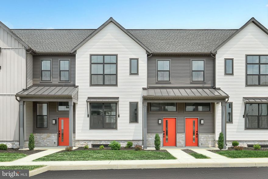 This 2-story townhome includes a 1-car, rear load garage with mudroom entry, 9’ ceilings on the first floor, and a patio for outdoor living. The kitchen is well equipped with stainless steel appliances, attractive cabinetry, and quartz countertops with a tile backsplash. The kitchen opens to a spacious dining area accented by a tray ceiling and then a sunny living room. The 2nd floor owner’s suite features an expansive closet, and a private bathroom with a double bowl vanity and 5’ shower. Adjacent to the suite are 2 additional bedrooms, a full bathroom, and a convenient laundry room.